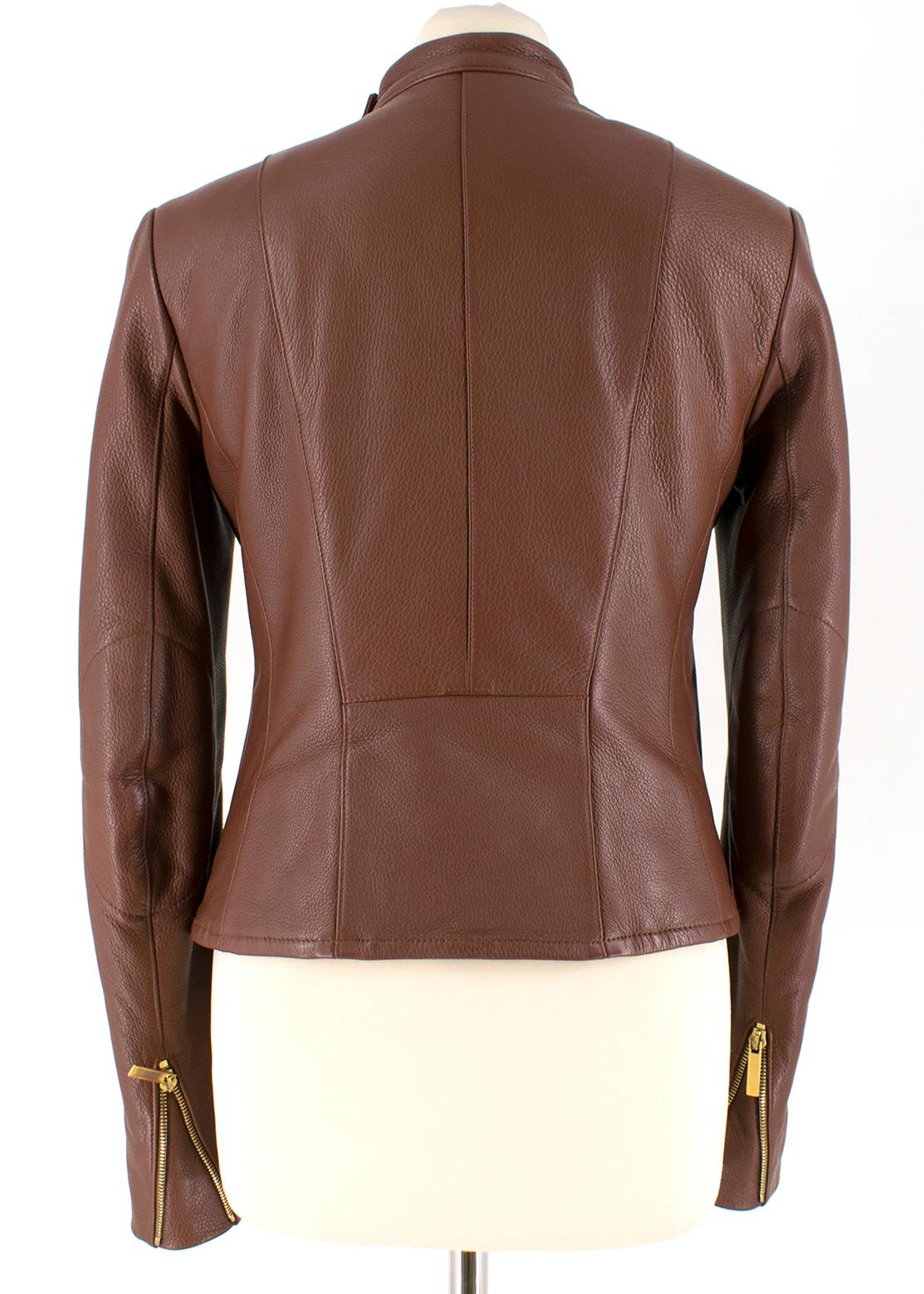 The Row Brown Deer Skin High Neck Leather Jacket 

- Brown, mid-weight, deer skin leather jacket
- Scoop neck with a button 
- Slim fit, lightweight 
- Long sleeves and asymmetric zip fastening
- Two front pockets 

Please note, these items are