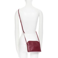 THE ROW burgundy red vintage inspired gold mirror trio zip pocket shoulder bag
