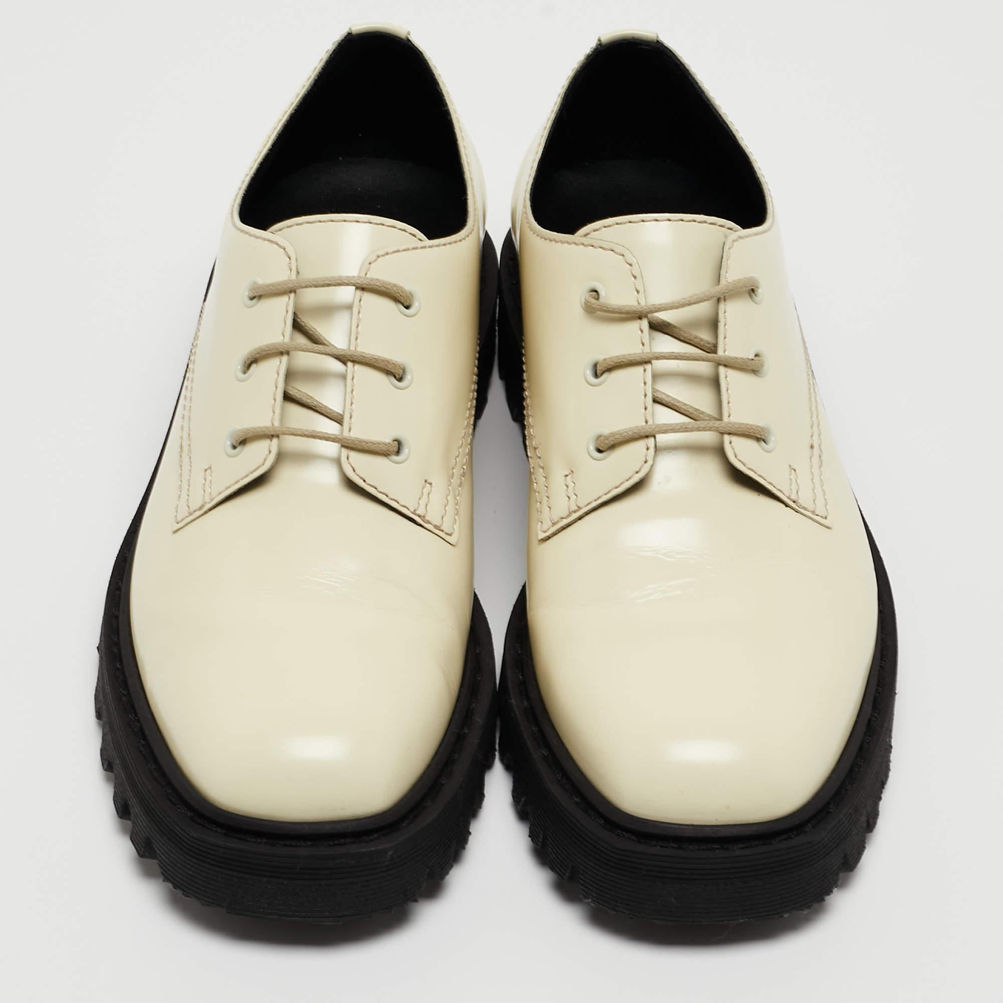 Give your outfit a luxe update with this pair of The Row derby shoes. The shoes are sewn perfectly to help you make a statement in them for a long time.

Includes: Original Dustbag, Original Box

