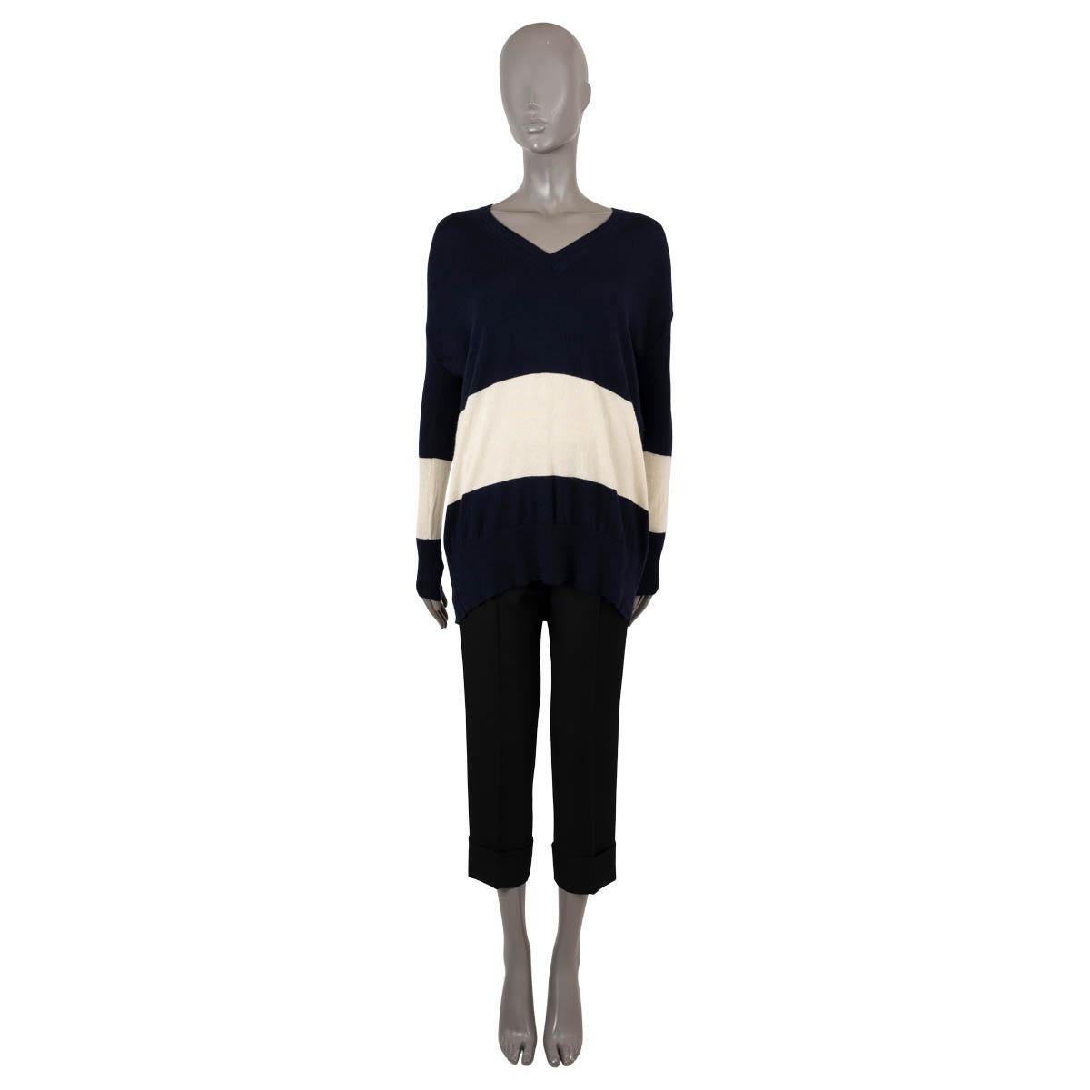 100% authentic The Row striped oversized v-neck sweater in navy and cream cashmere (missing content tag). Has been worn and is in very good condition. 

Measurements
Tag Size	M (missing tag)
Size	M
Shoulder Width	59cm (23in)
Bust From	120cm