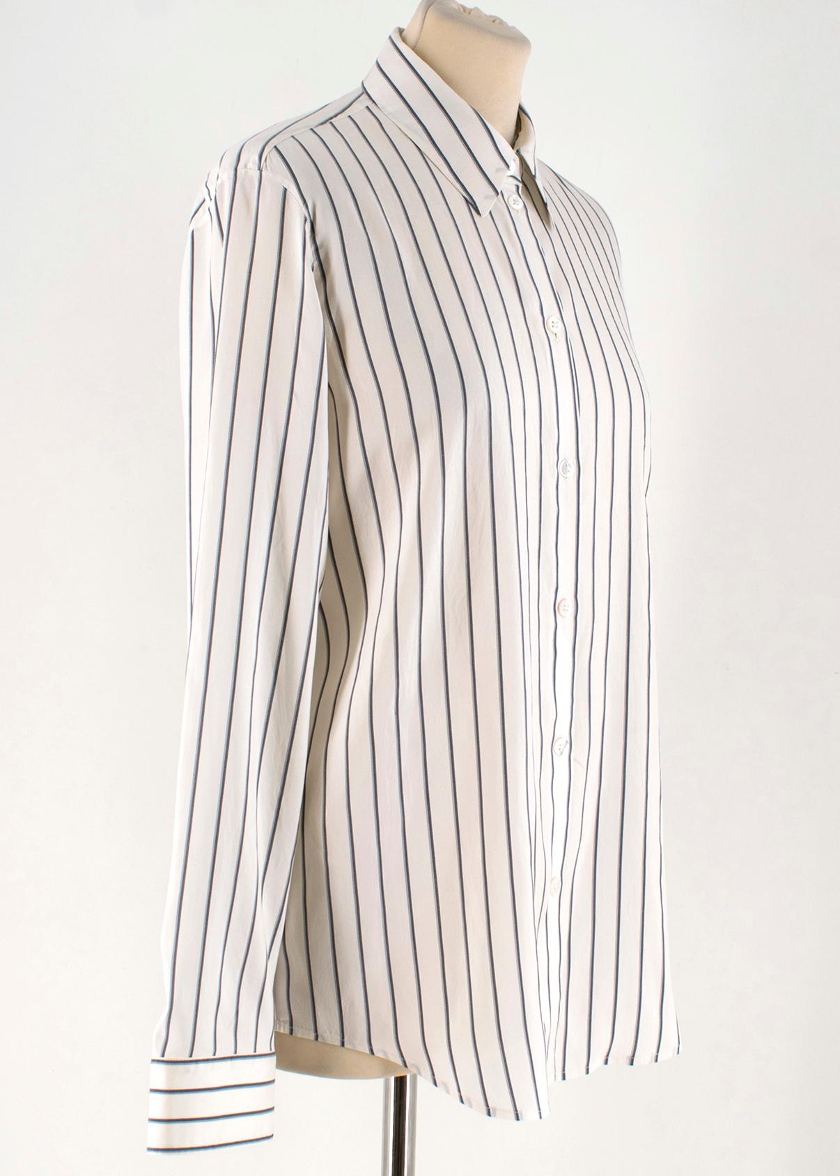 The Row Cream Striped Silk 'Peter' Shirt 

- Cream Striped Shirt
- 100% Silk
- Black striped print
- Point collar, buttoned down center front 
- Buttoned sleeve cuffs
- Lightweight

Please note, these items are pre-owned and may show some signs of