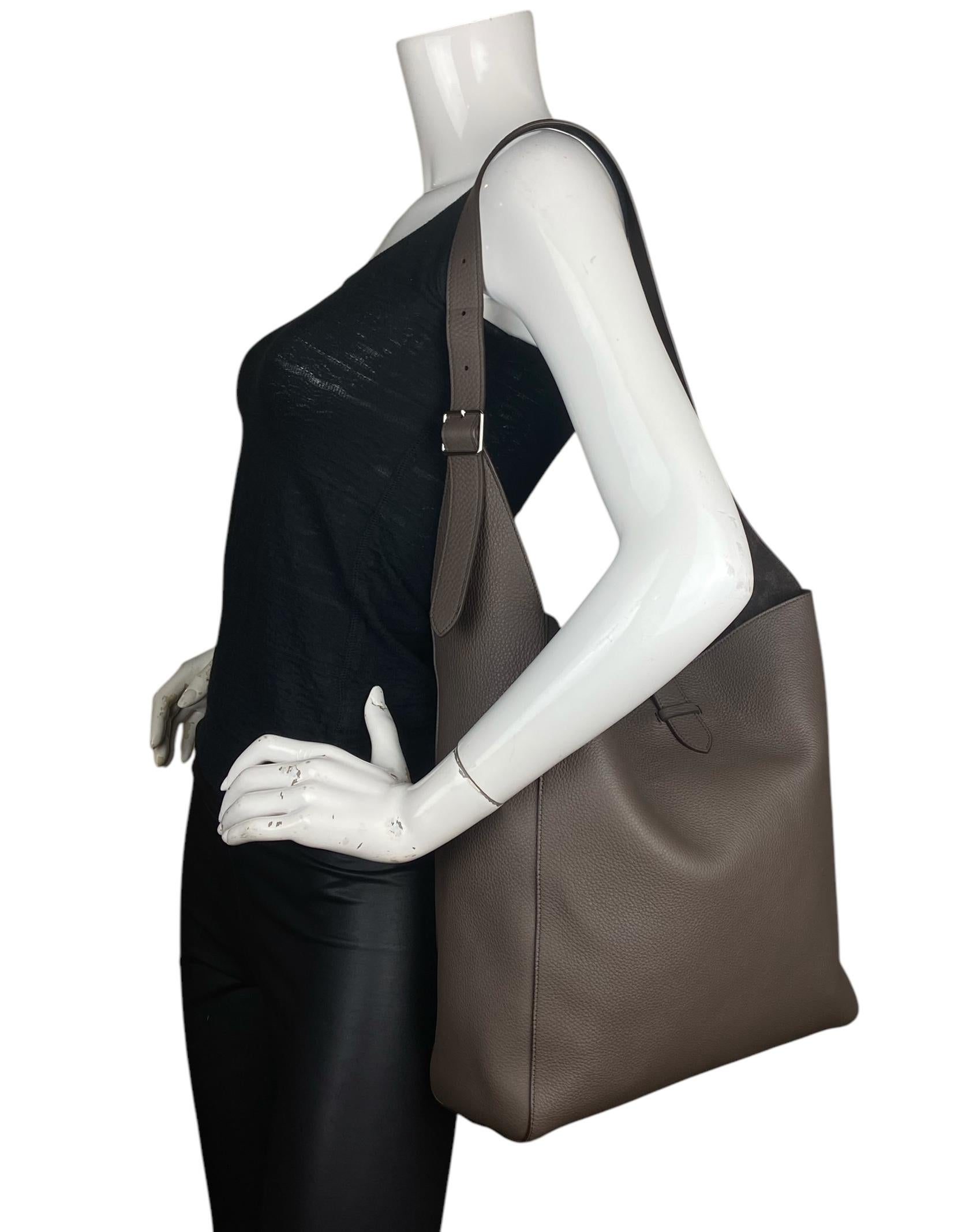 The Row Grey Blake Hobo Lux Grain Shoulder Bag 

Made In: Italy
Color: Elephant grey
Hardware: None
Materials: Lux grain calf leather
Lining: Suede
Closure/Opening: Open with center tab
Exterior Pockets: None
Interior Pockets:  None
Exterior