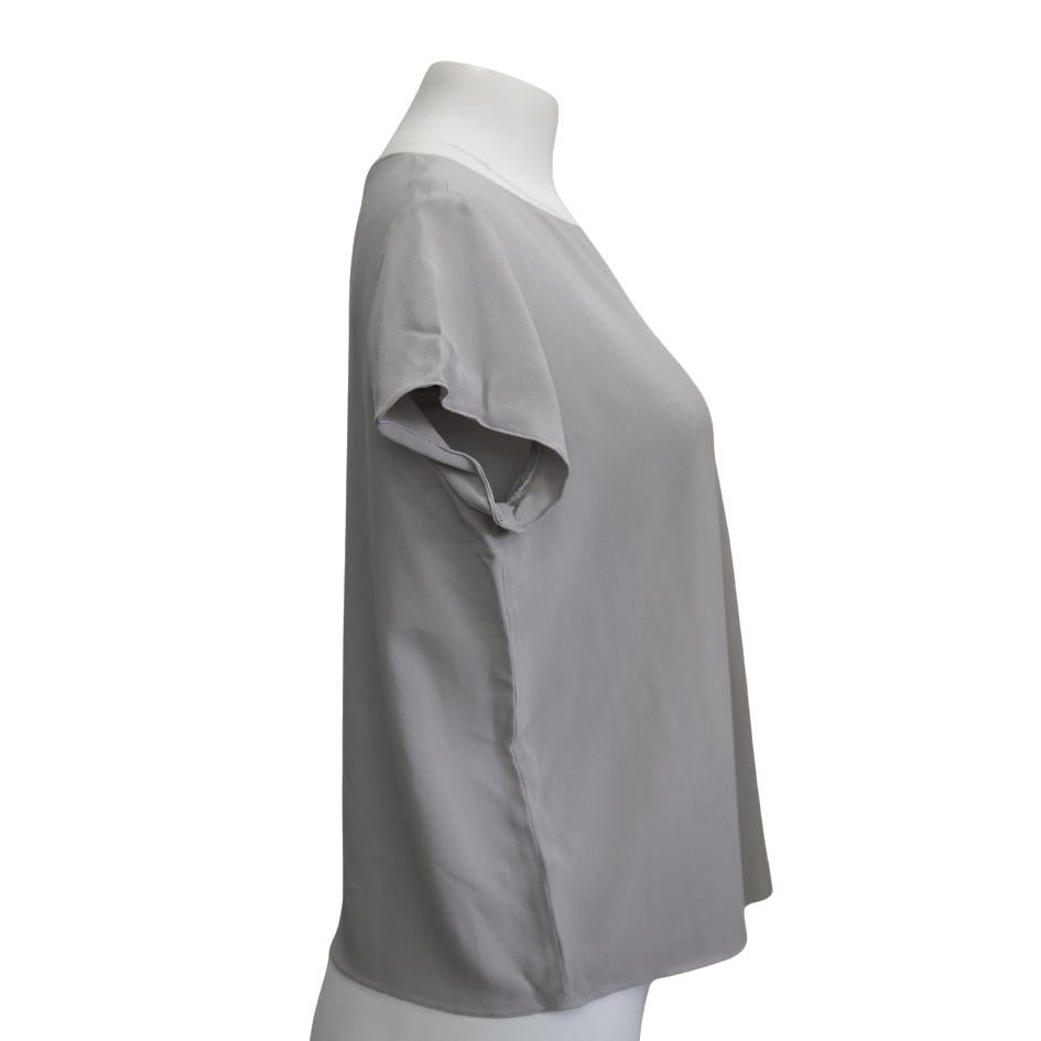 The row grey blouse 
Size 6
Length: 22.5” 
Bust: 44