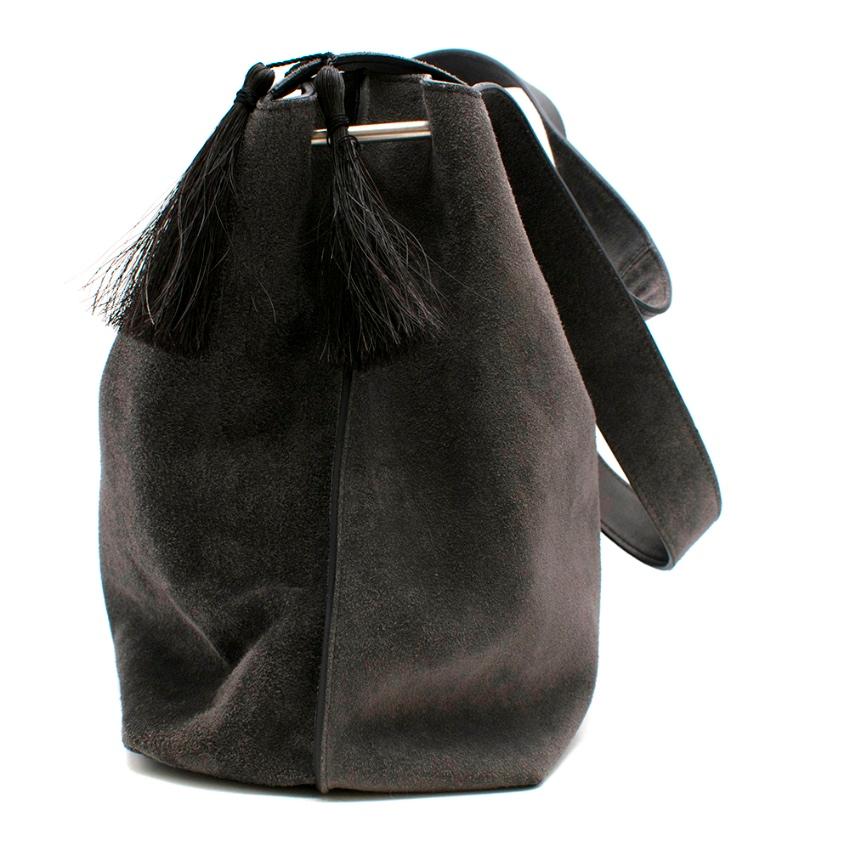 The Row Grey Suede Duplex Shoulder Bag 

Crafted of grey suede, The Row's Duplex boxy shoulder bag is embellished at sides with tasseled embroidery.   Metal bars at topline sides.  Brushed silvertone hardware. Lined with grey suede. Leather zip