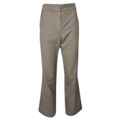 Pantaloni a zampa a vita alta di The Row in lana beige