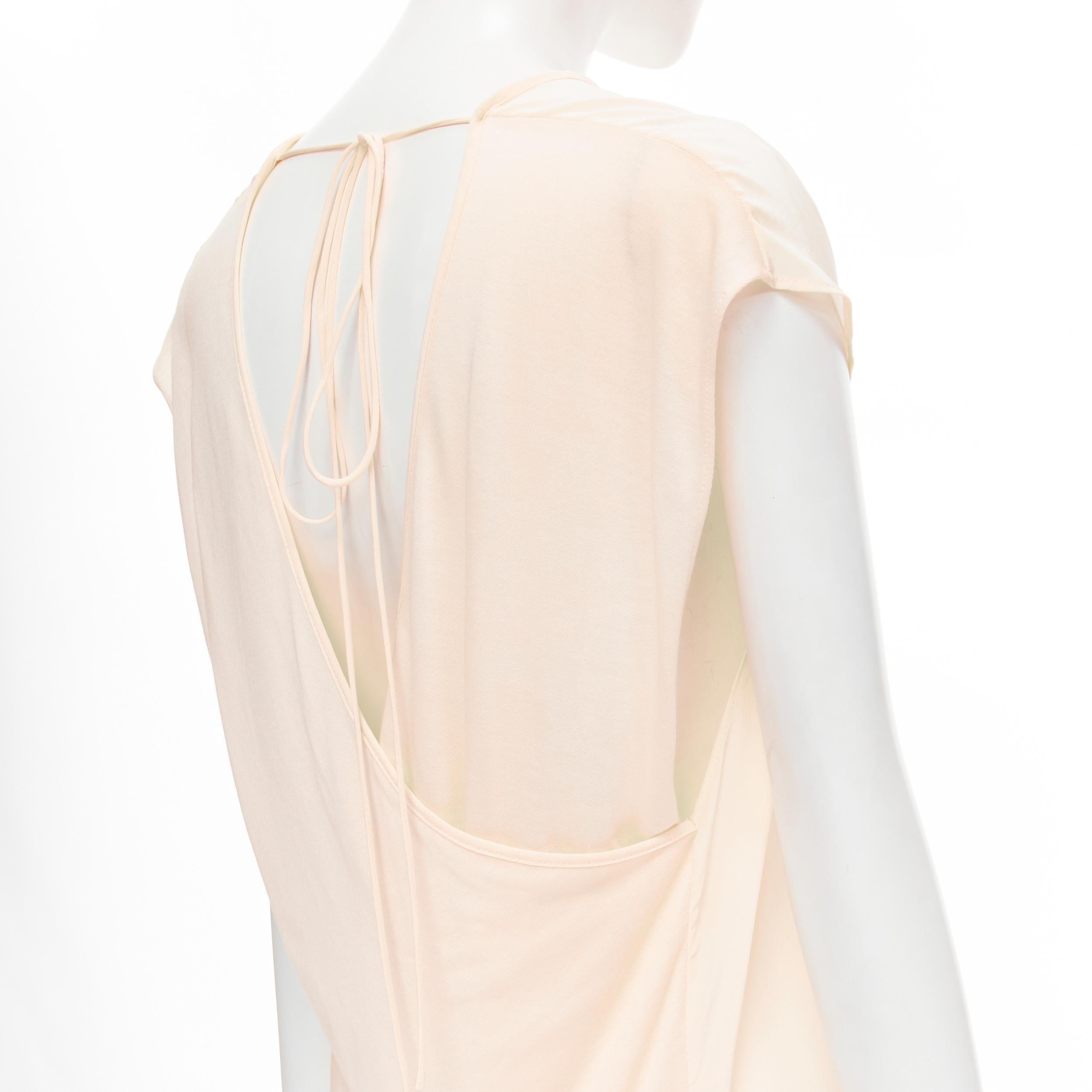 THE ROW ivory cream mixed silk modal knit wrap tie back tunic vest XS 
Reference: MELK/A00113 
Brand: The Row 
Material: Silk 
Color: Beige 
Pattern: Solid 
Extra Detail: Silk front. Modal knitted cross back. Tie nape. 
Made in: USA 

CONDITION: