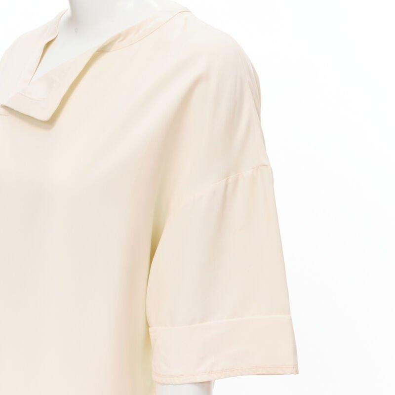 THE ROW ivory cream triple pocket asymmetric collar boxy silk dress US0 XS
Reference: MELK/A00105
Brand: The Row
Designer: Mary Kate and Ashley Olsen
Material: Silk
Color: Beige
Pattern: Solid
Extra Details: Asymmetric fold down collar. Triple