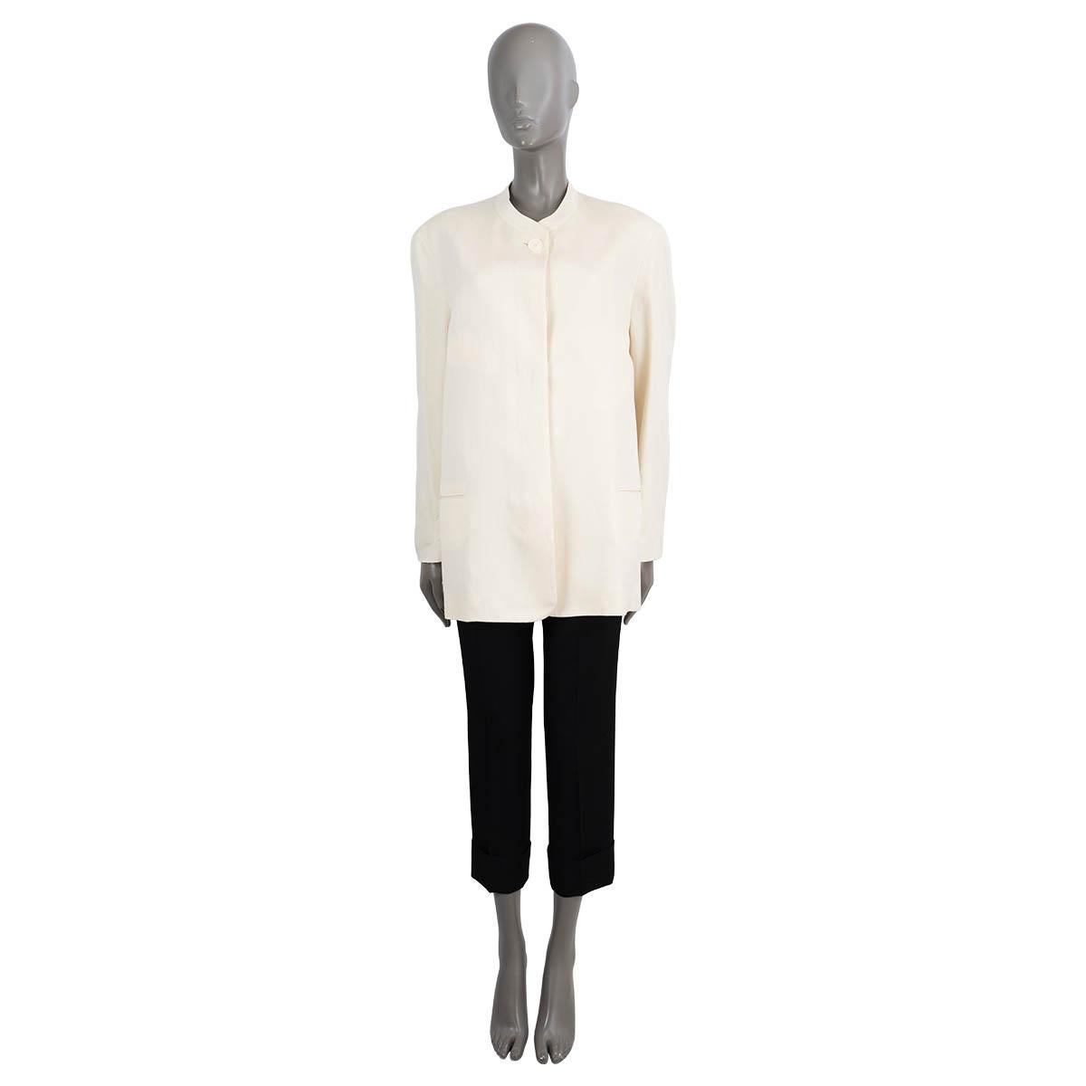 100% authentic The Row Aradia oversized jacket in ivory silk (64%) and linen (36%). Features a straight cut, band collar, two welt pockets and a single exposed button at the neck. Closes with concealed buttons down the front and is lined in cotton