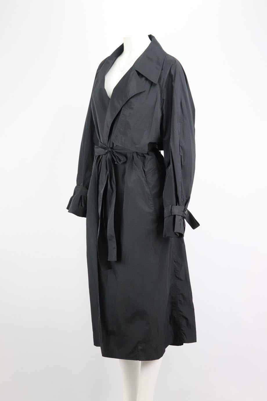 This 'Kareem' trench coat by The Row is made from lightweight shell, so you can wear it year-round, it's cut in a relaxed fit with an oversized storm flap and pockets for your phone, keys and cardholder. Black shell. Belt fastening at front. 100%