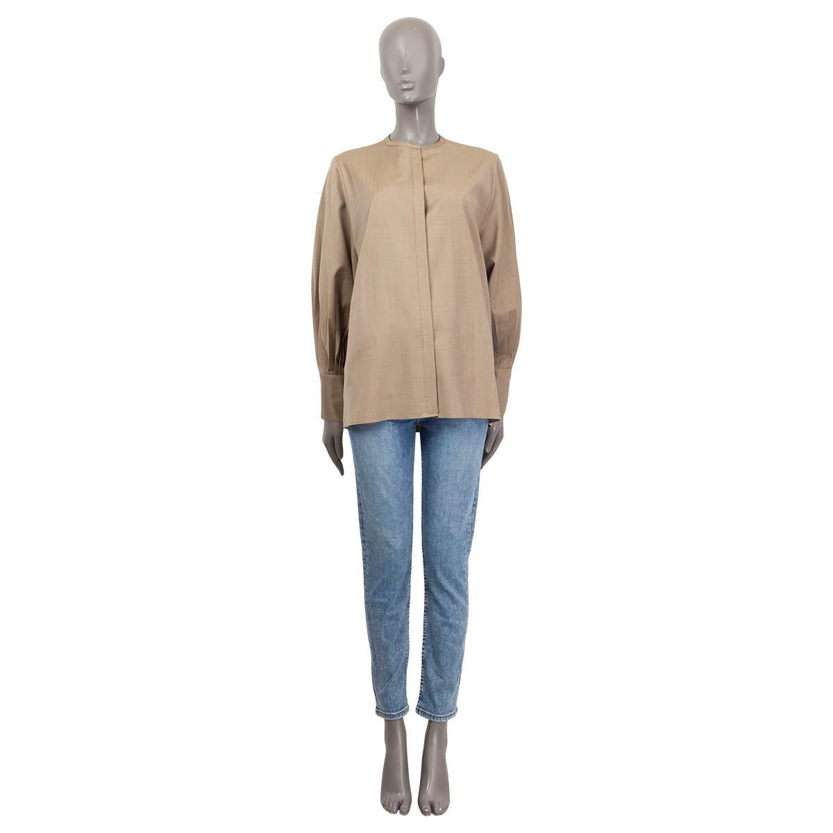 100% authentic The Row long sleeve oversized shirt in khaki virgin wool (100%). Features buttoned and pleated cuffs. Opens with six concealed buttons and a hook on the front. Unlined. Has been worn once and is in virtually new