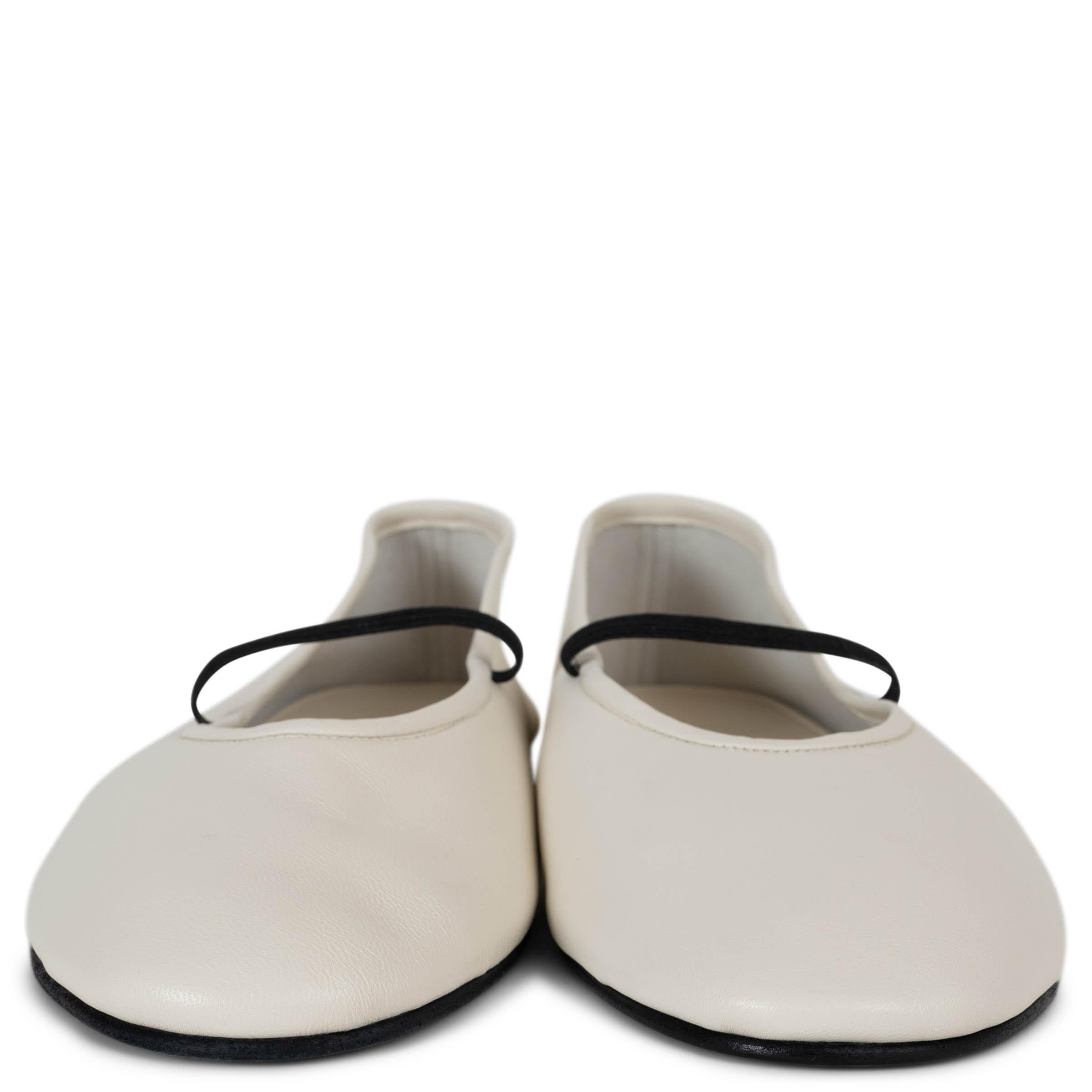 This 100% authentic The Row Elastic Mary-Jane ballet flats in Milk white supple leather embody effortless elegance with a modern touch. Featuring a contrasting black elastic band across the front for a secure fit, they are designed with classic