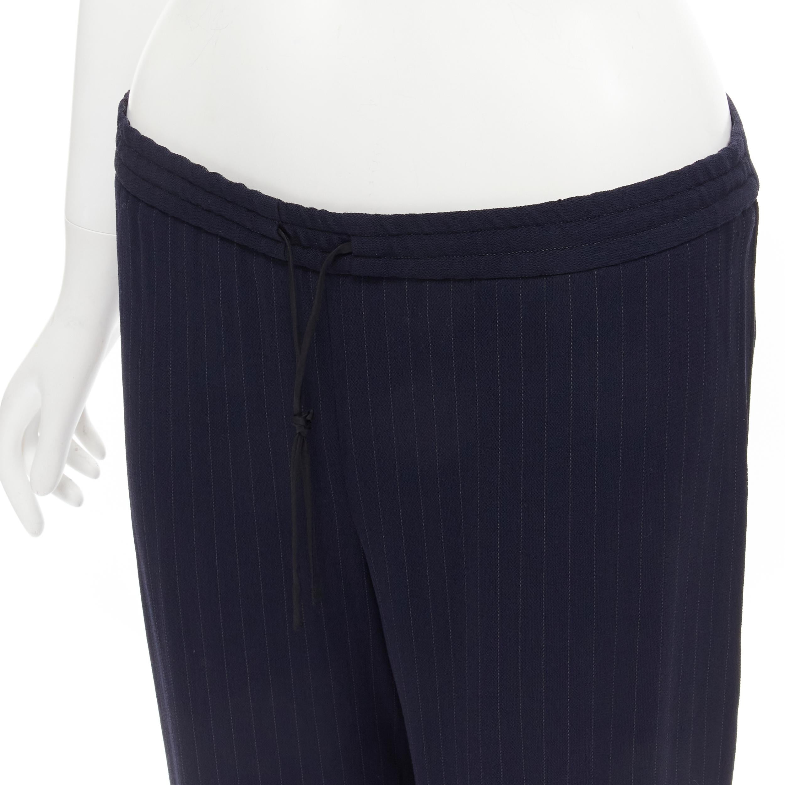 THE ROW navy blue pinstripe flowy relaxed trousers pants US0 XS
Brand: The Row
Designer: Mary Kate and Ashley Olsen
Color: Navy
Pattern: Striped
Extra Detail: Single back pocket.
Made in: United States

CONDITION:
Condition: Excellent, this item was