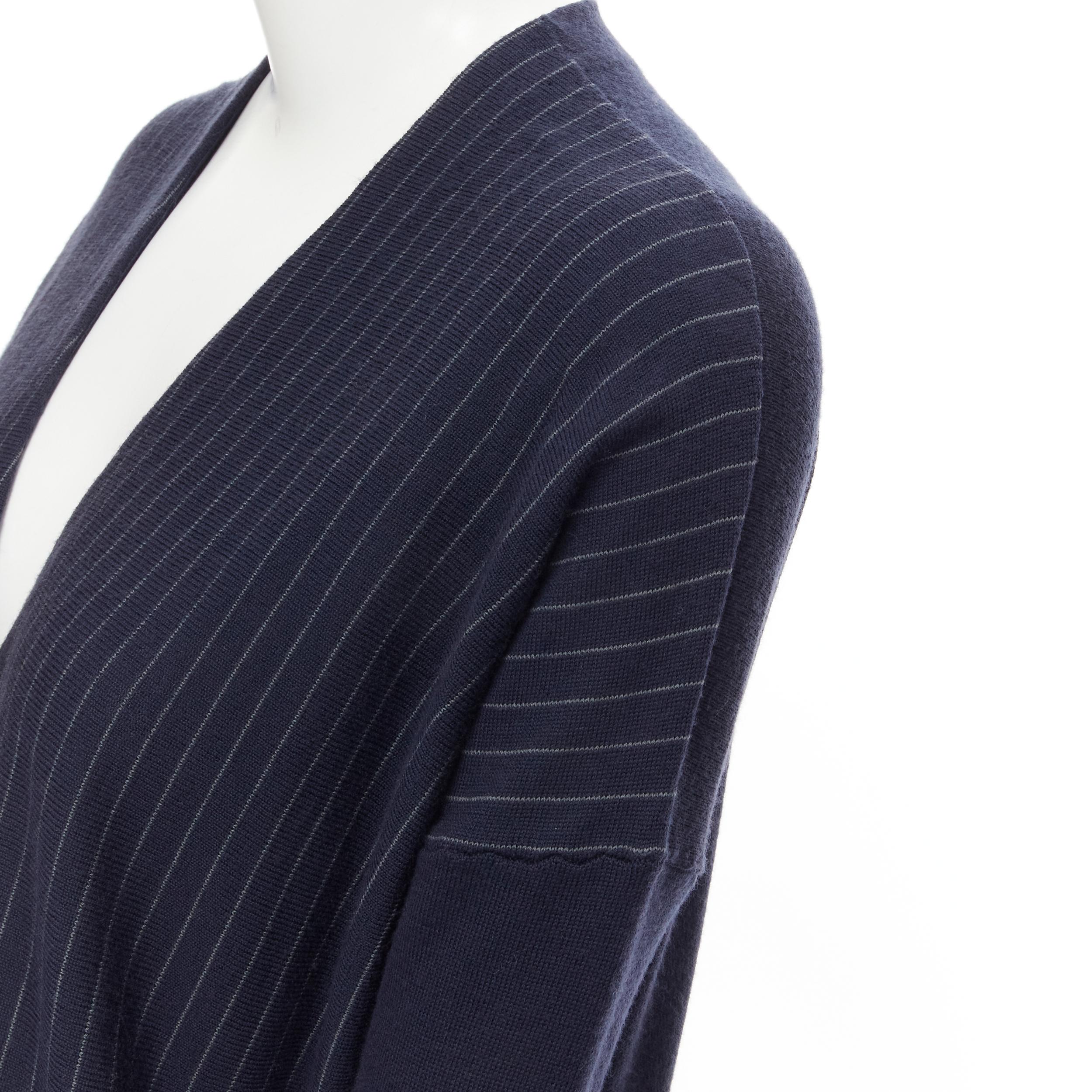 THE ROW navy blue pinstripe silver mirrored button long length cardigan XS 
Reference: MELK/A00055 
Brand: The Row 
Color: Navy 
Pattern: Striped 
Closure: Button 
Extra Detail: Dropped shoulder seam. Fitted sleeves. 
Made in: USA 

CONDITION: