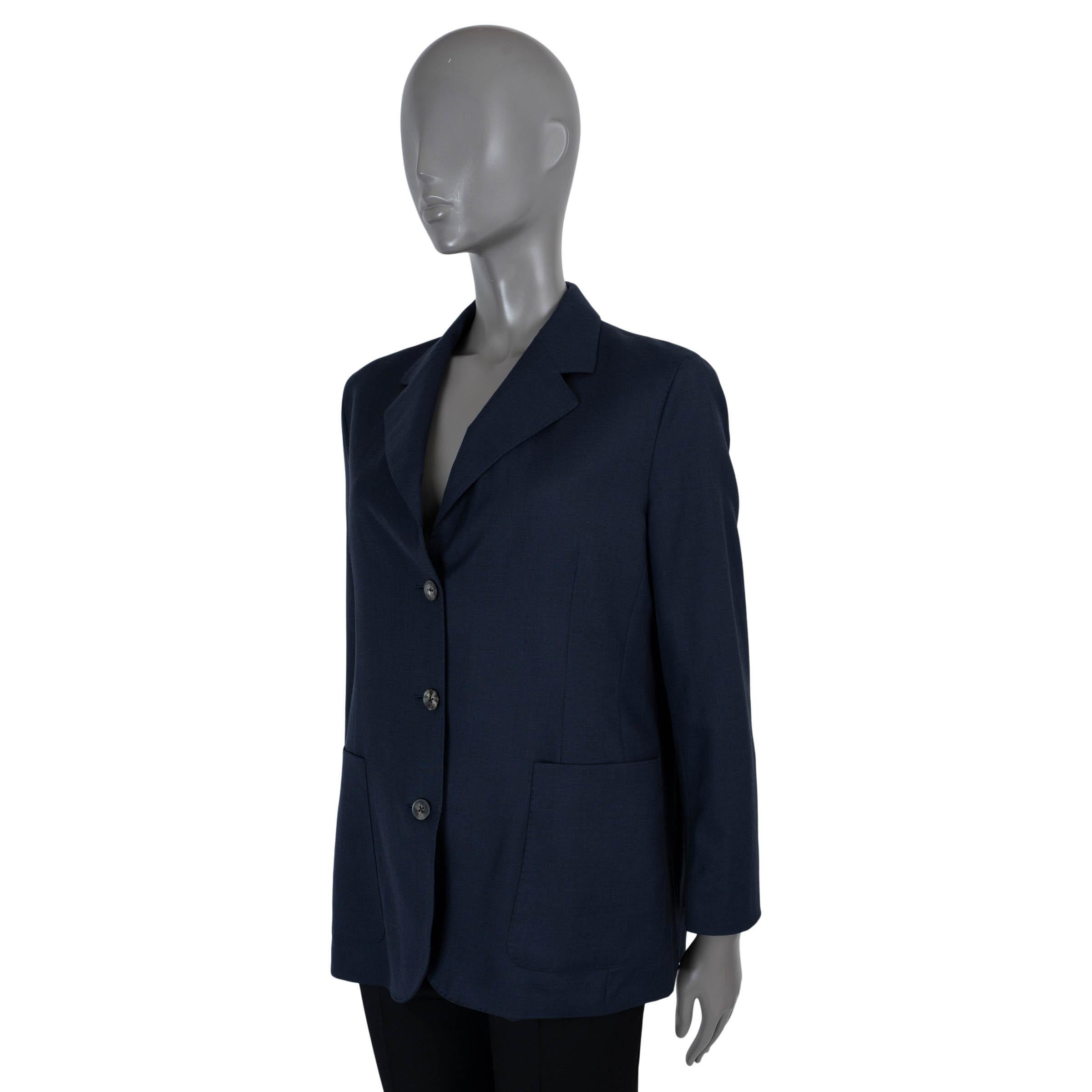 100% authentic The Row summer wool (100%) navy blue blazer jacket with classic notch lapel, soft padded shoulders, two front patch pockets, three horn front buttons and four cuff buttons. Lined in navy blue silk (100%). Has been worn and is in