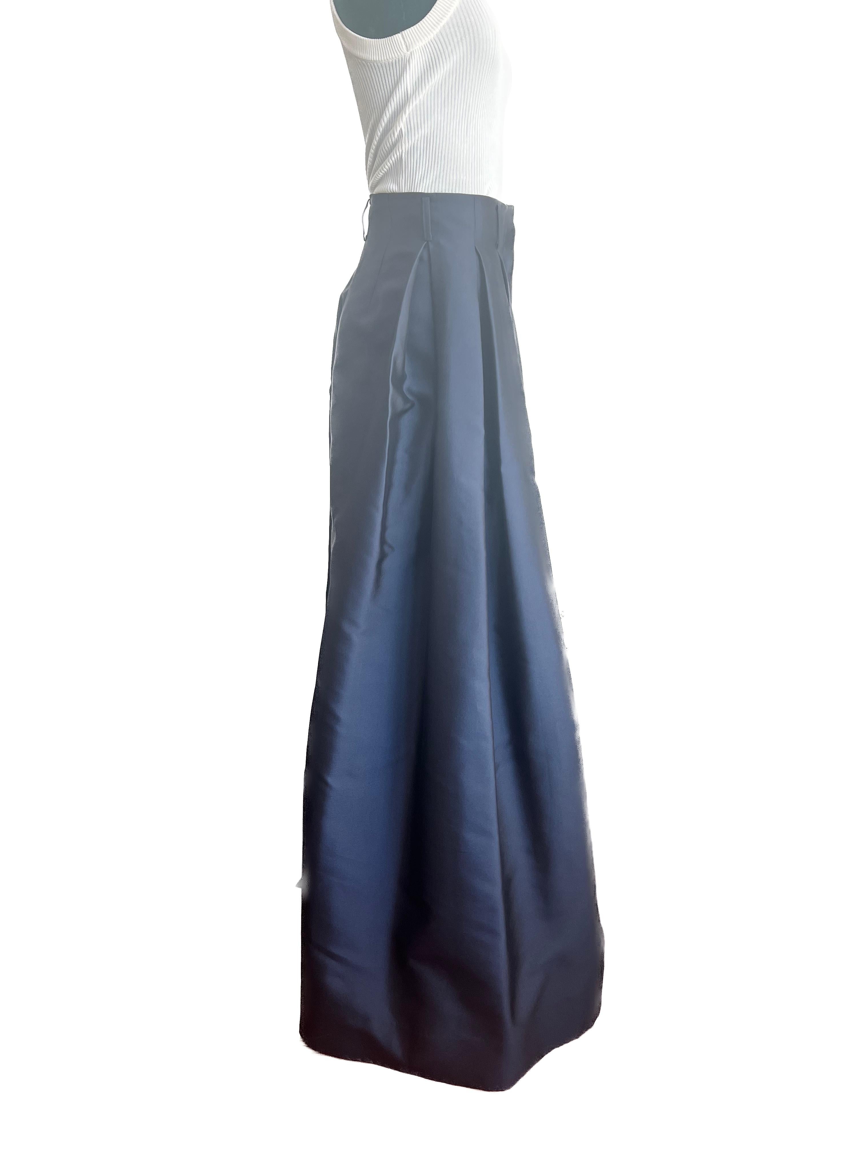 Drape yourself in refined elegance with The Row's Silk Navy Wide Pant, a luxurious embodiment of sophisticated minimalism. Crafted from sumptuous silk, these pants offer a fluid silhouette that gracefully cascades down, ensuring both comfort and a