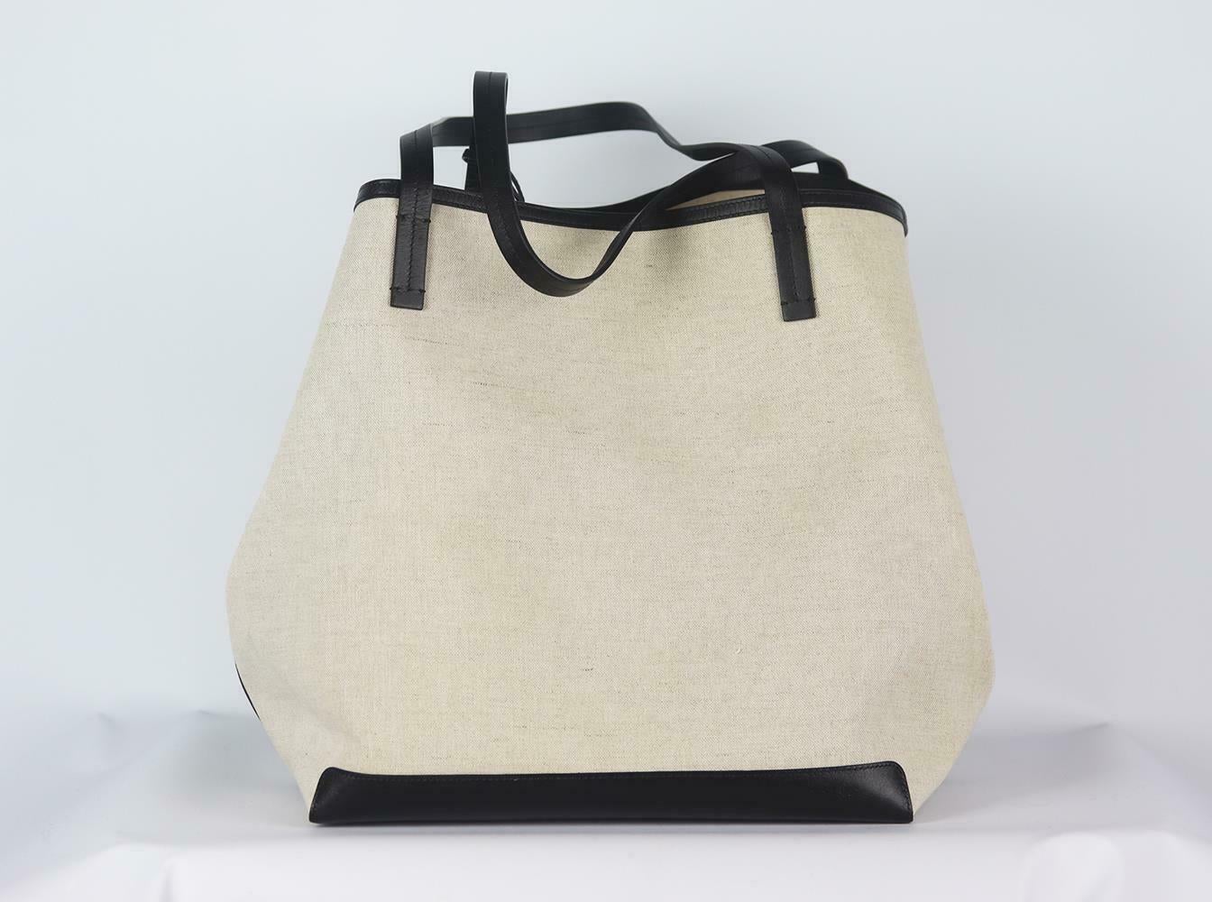 Suited to both long commutes and overnight stays, The Row's pared-back 'Park XL' tote has been made in Italy from durable canvas and trimmed with leather. The sturdy base adds structure, while the slim top handles fit comfortably over your shoulder.