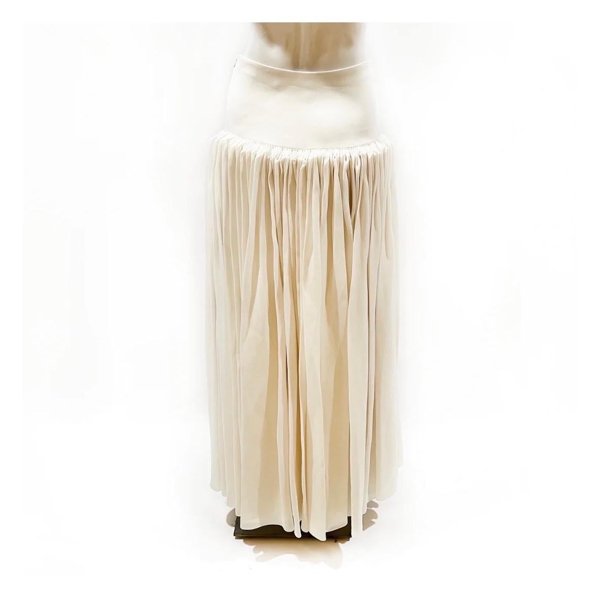 Pleated maxi skirt by The Row
Fall 2018 Ready-to-Wear
Made in USA
Ivory 
Drop waist
Dramatic accordion style pleating 
Side zipper and hook closure
100% silk  
Condition: Excellent; zero signs of wear.  
Size/Measurements:
Size 2
28