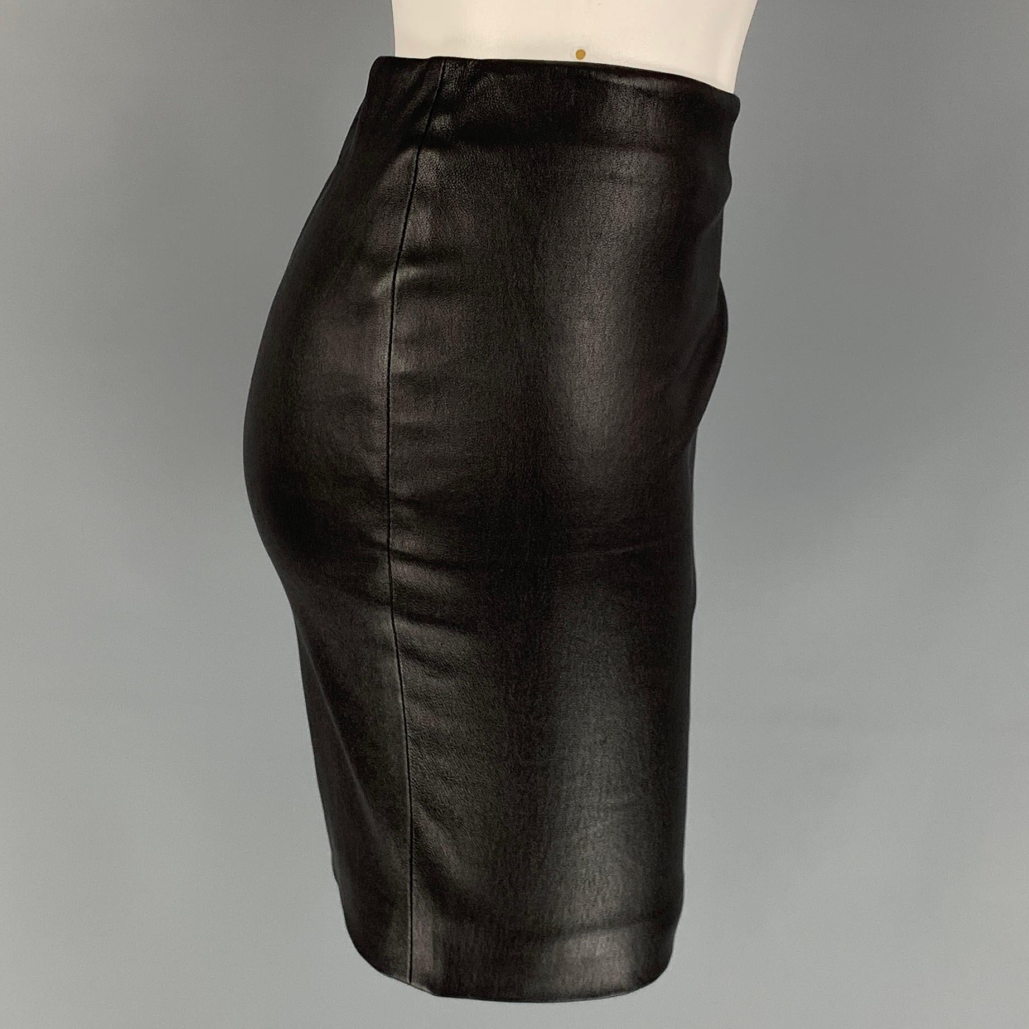 THE ROW mini skirt comes in a black lambskin stretch leather featuring a elastic waistband. Made in USA, 

Very Good Pre-Owned Condition.
Marked: 4
Original Retail Price: $1,690.00

Measurements:

Waist: 29 in.
Length: 16 in. 