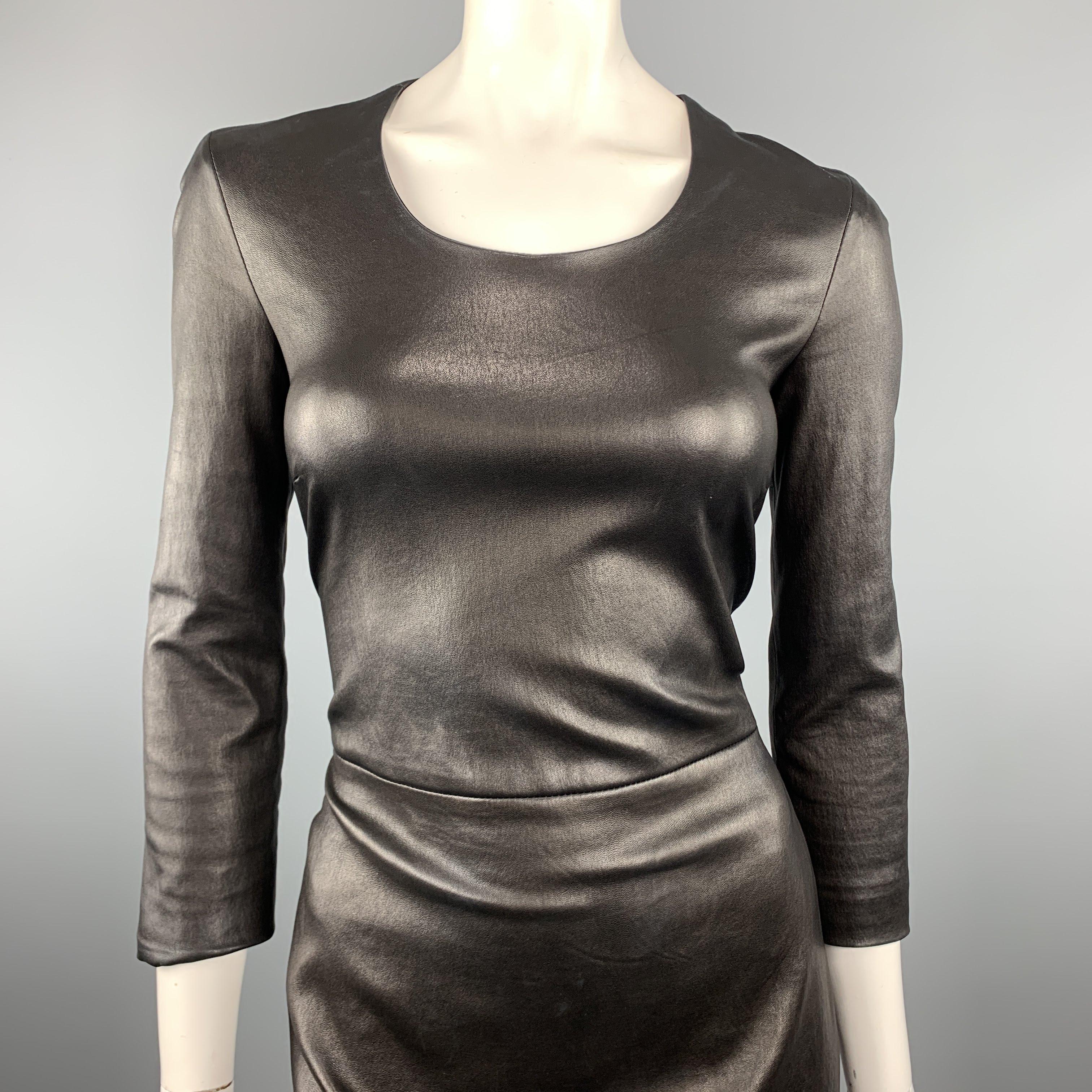 THE ROW sheath dress comes in black stretch leather with a scoop neck, long sleeves, and back zip closure. Made in USA.
 
Excellent Pre-Owned Condition.
Marked: 8
 
Measurements:
 
Shoulder: 15 in.
Bust: 34 in.
Waist: 28 in.
Hip: 34 in. in.
Sleeve: