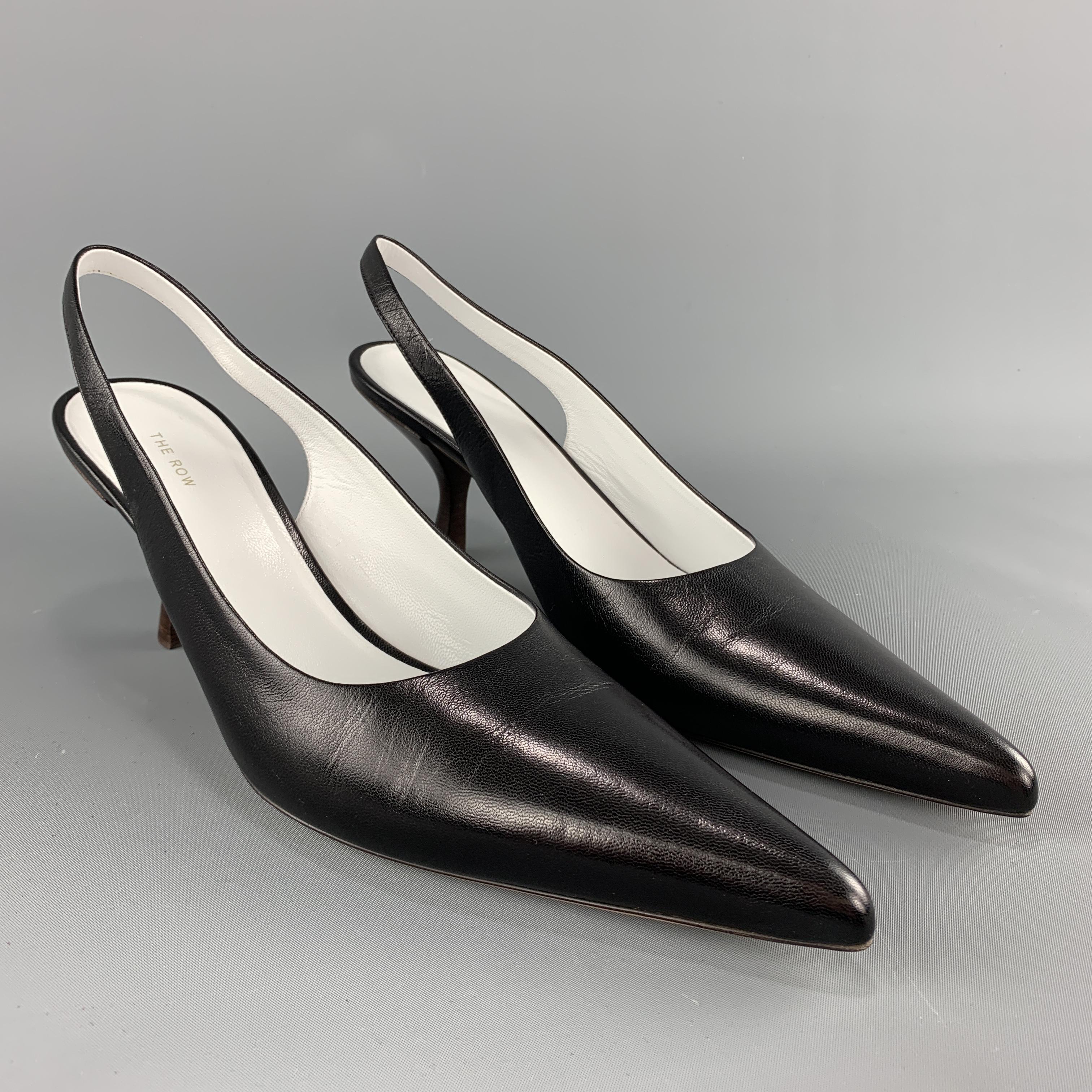 THE ROW Bourgeoise Sling pumps come in black leather with a pointed toe, sling back, and brown stacked kitten heel. Made in Italy. 

New with Box. Pre-Owned Condition.
Marked: IT 39.5

Heel: 3.5 in.