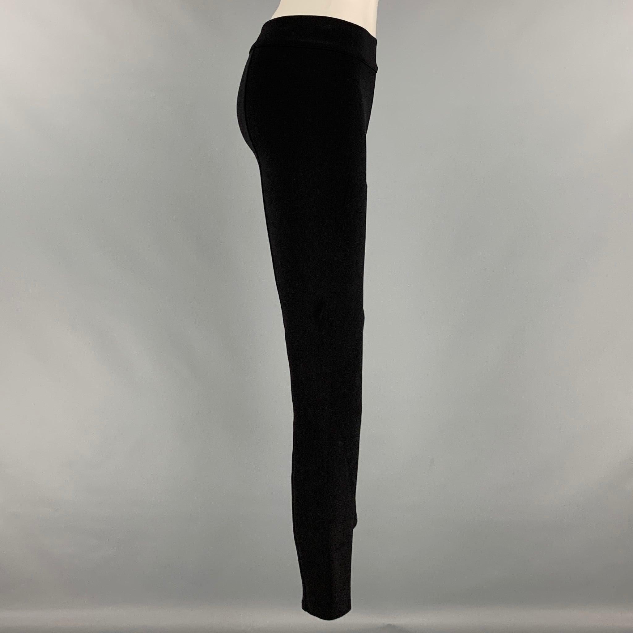 THE ROW leggings comes in a black nylon blend featuring an elastic waistband. MAde in USA.Excellent Pre-Owned Condition. 

Marked:   S 

Measurements: 
  Waist: 27 inches Rise: 9 inches Inseam: 28 inches  
  
  
 
Reference: 127392
Category:
