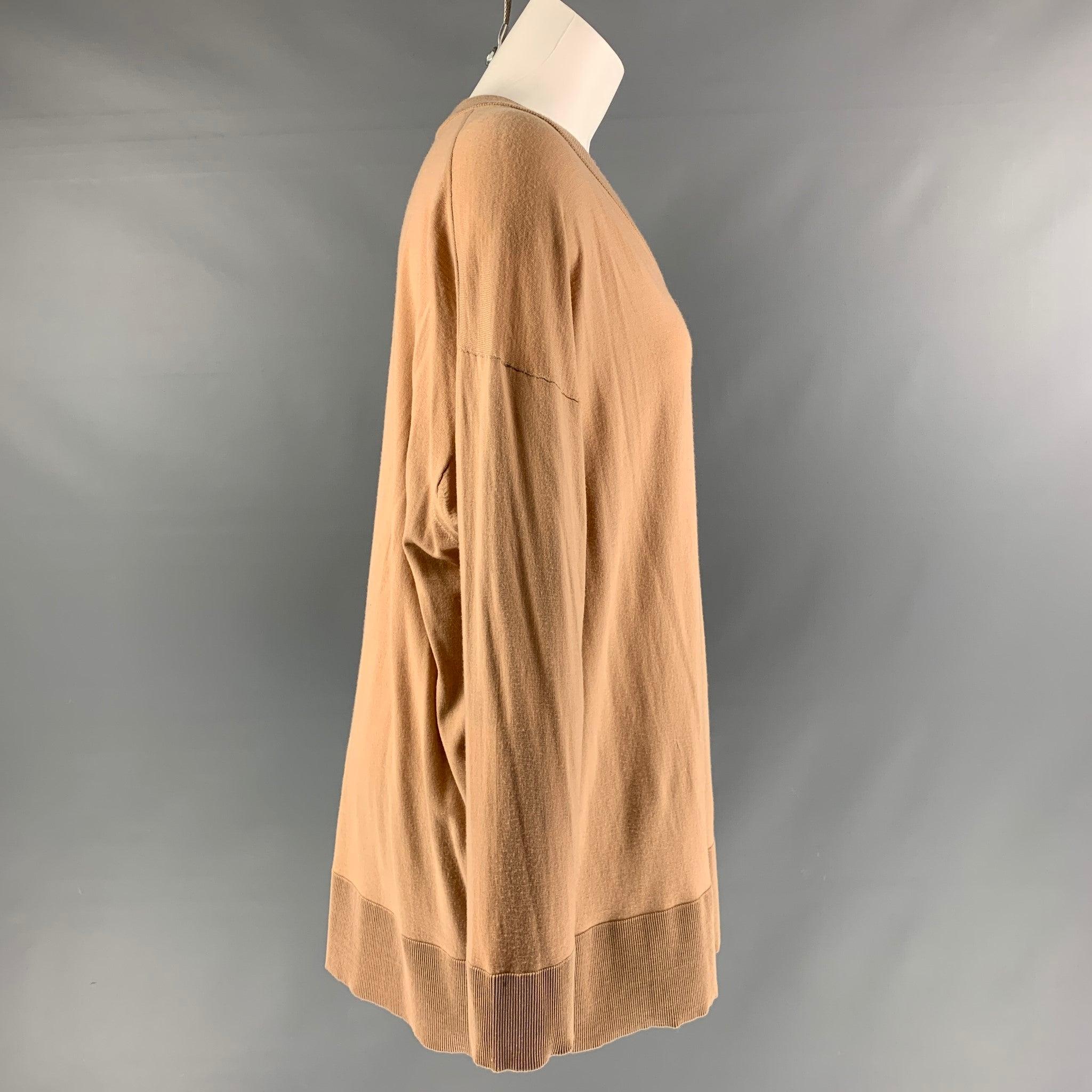 THE ROW pullover comes in a camel wool jersey fabric featuring an oversized fit, and v-neck. Made in Italy.Excellent Pre-Owned Condition. 

Marked:   XS 

Measurements: 
 
Shoulder: 19 inches  Chest: 52 inches  Sleeve:
 25 inches  Length: 28 inches 