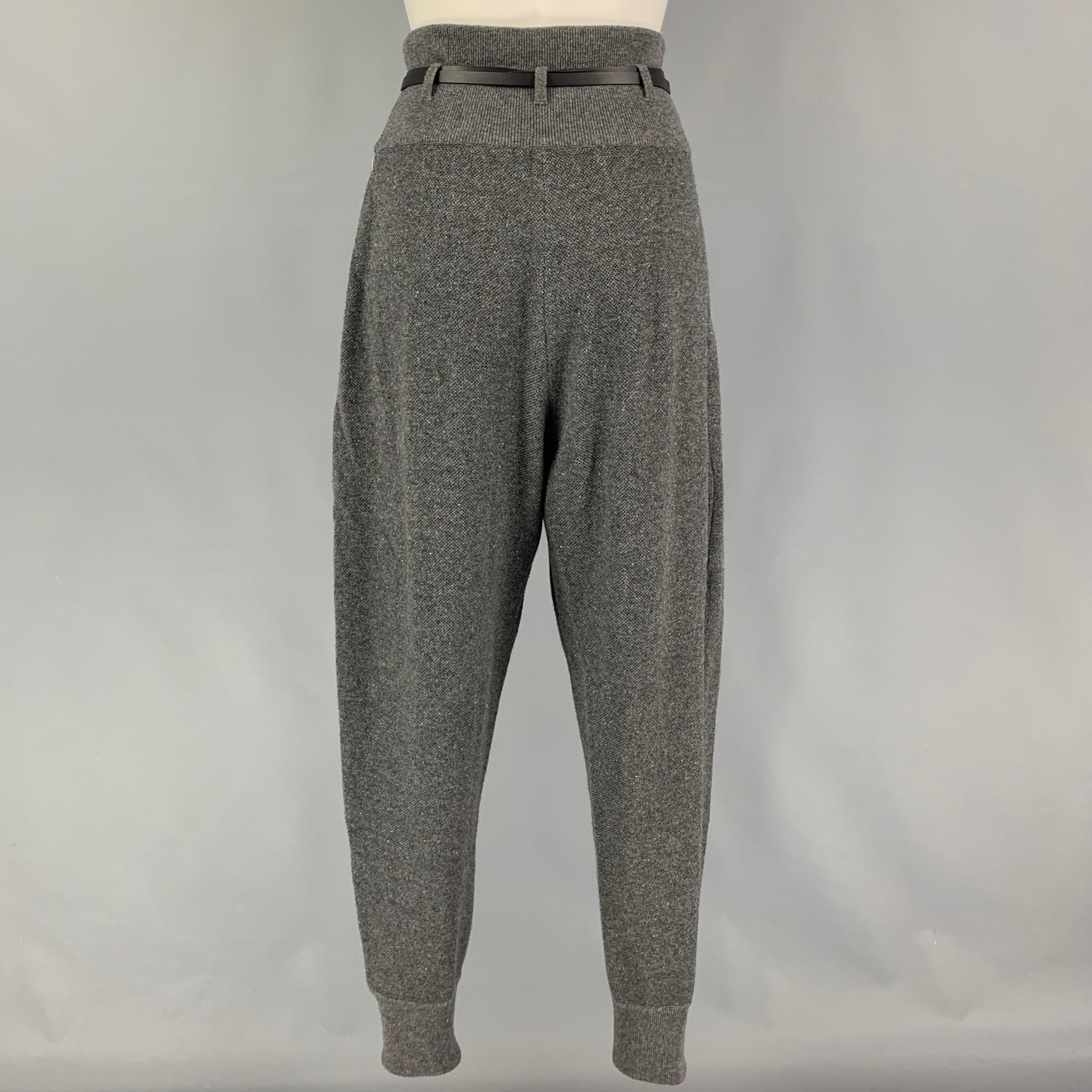 THE ROW pants comes in a grey cashmere / silk featuring a pleated style, high waist, side slit pockets, anda black belt detail. 

Very Good Pre-Owned Condition.
Marked: XS
Original Retail Price: $1,360.00

Measurements:

Waist: 26 in.
Rise: 16