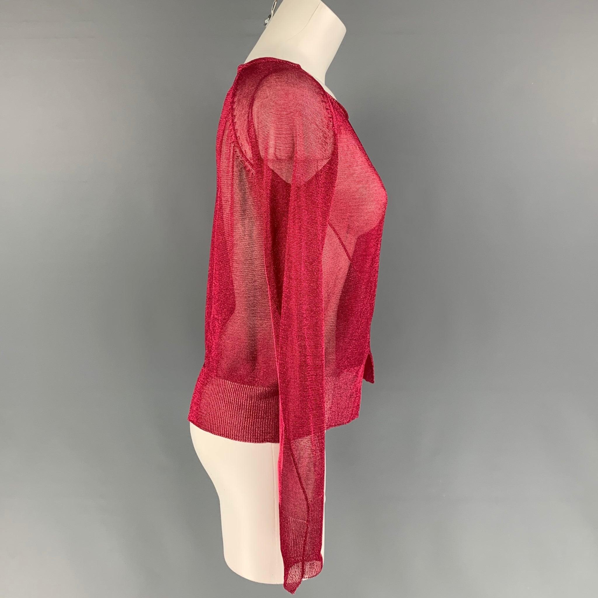 THE ROW 'Giro Vented' top comes in a red metallic viscose blend featuring a boat neck, long sleeves, and a pullover style. Made in Italy.
Excellent
Pre-Owned Condition. 

Marked:   XS 

Measurements: 
 
Shoulder: 16 inches  Bust: 34 inches  Height: