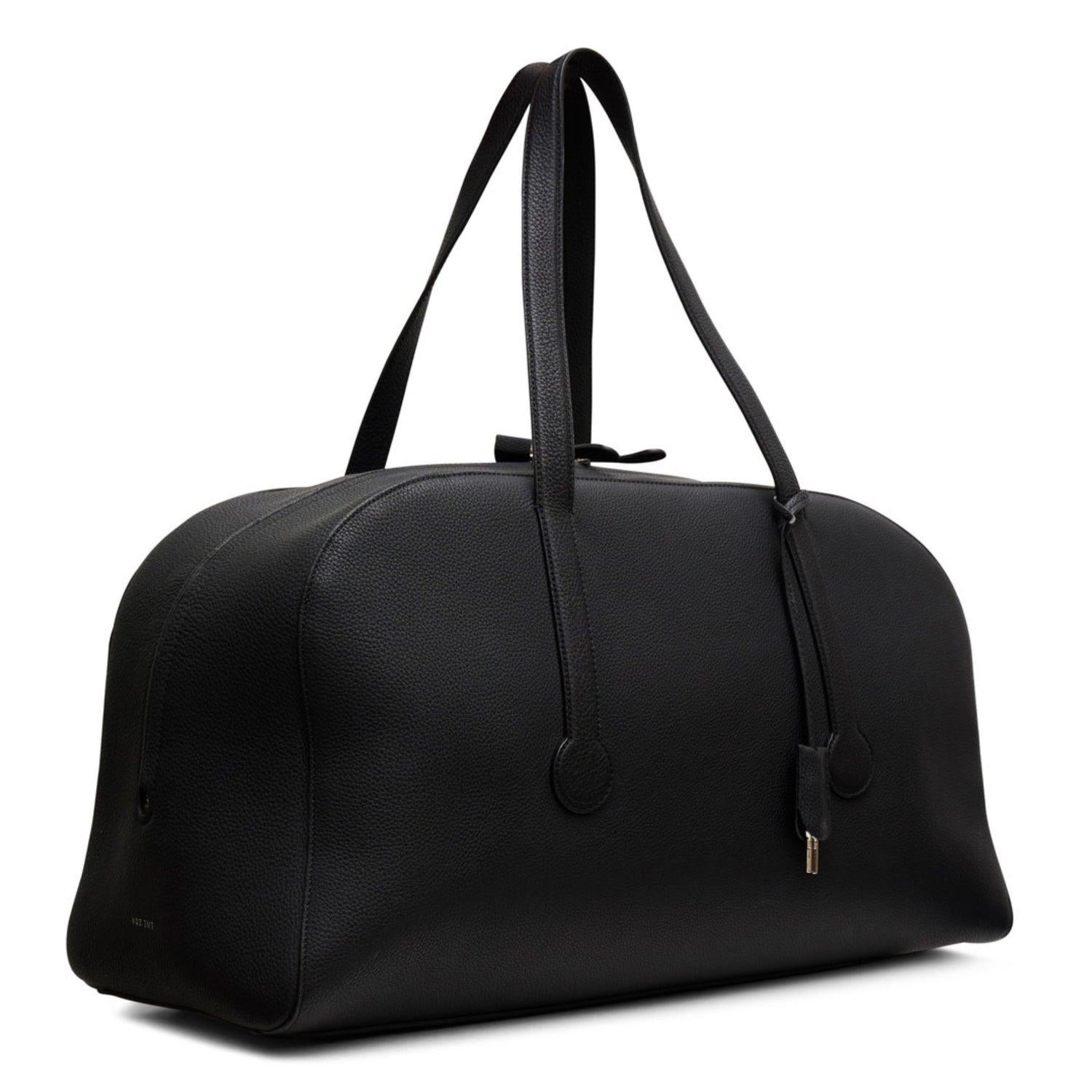 Black leather
Bowling bag

Silver-tone hardware
Two top handles
Lock and keys charm detail

Top zip fastening with two zips
Main compartment
Inner zipped compartment
Suede lining

Condition: Excellent
This pre–loved bag is in excellent condition,