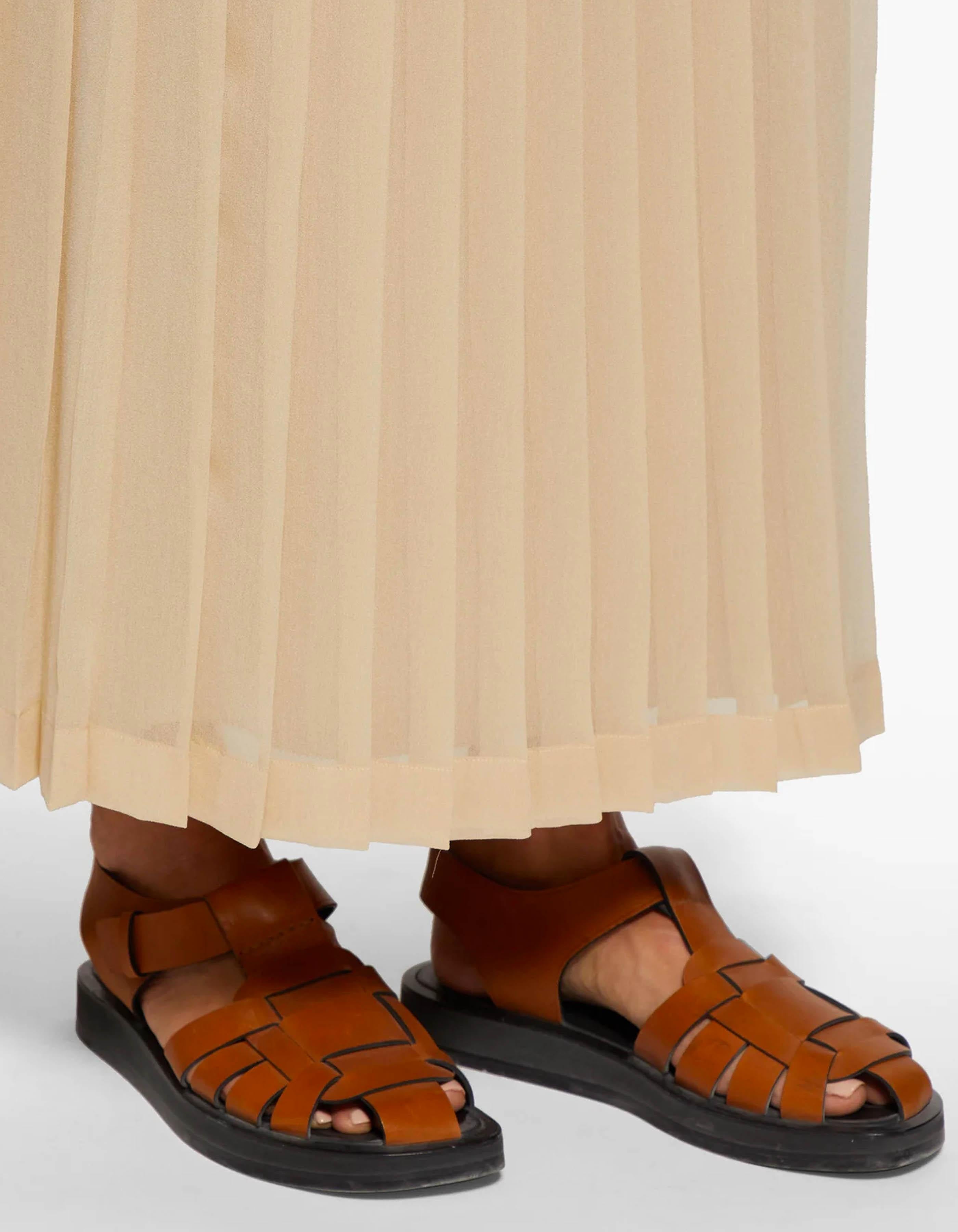 The Row Tan Leather Fisherman Caged T Strap Sandals sz 37.5

Made In: Italy
Year of Production: 2019-2020
Color: Tan
Hardware: Goldtone
Materials: Leather and rubber
Closure/Opening: Ankle buckle
Overall Condition: Excellent with a few light