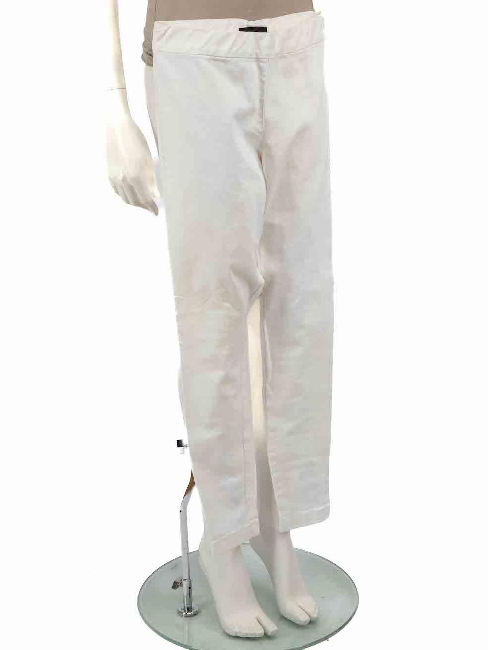 CONDITION is Very good. Minimal wear to trousers is evident. Minimal wear to the right leg with a small mark to the front on this used The Row designer resale item.
 
 
 
 Details
 
 
 White
 
 Cotton
 
 Skinny trousers
 
 Low rise
 
 Zipped cuffs
