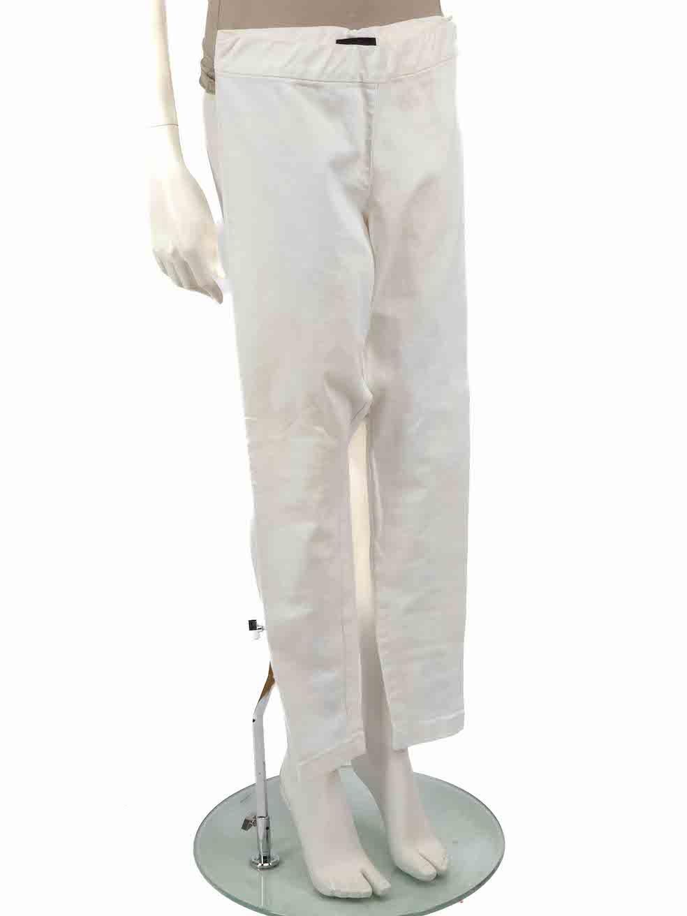 CONDITION is Very good. Minimal wear to trousers is evident. Minimal wear to the right leg with a small mark to the front on this used The Row designer resale item.



Details


White

Cotton

Slim fit trousers

Low rise

Zipped cuffs

Slightly