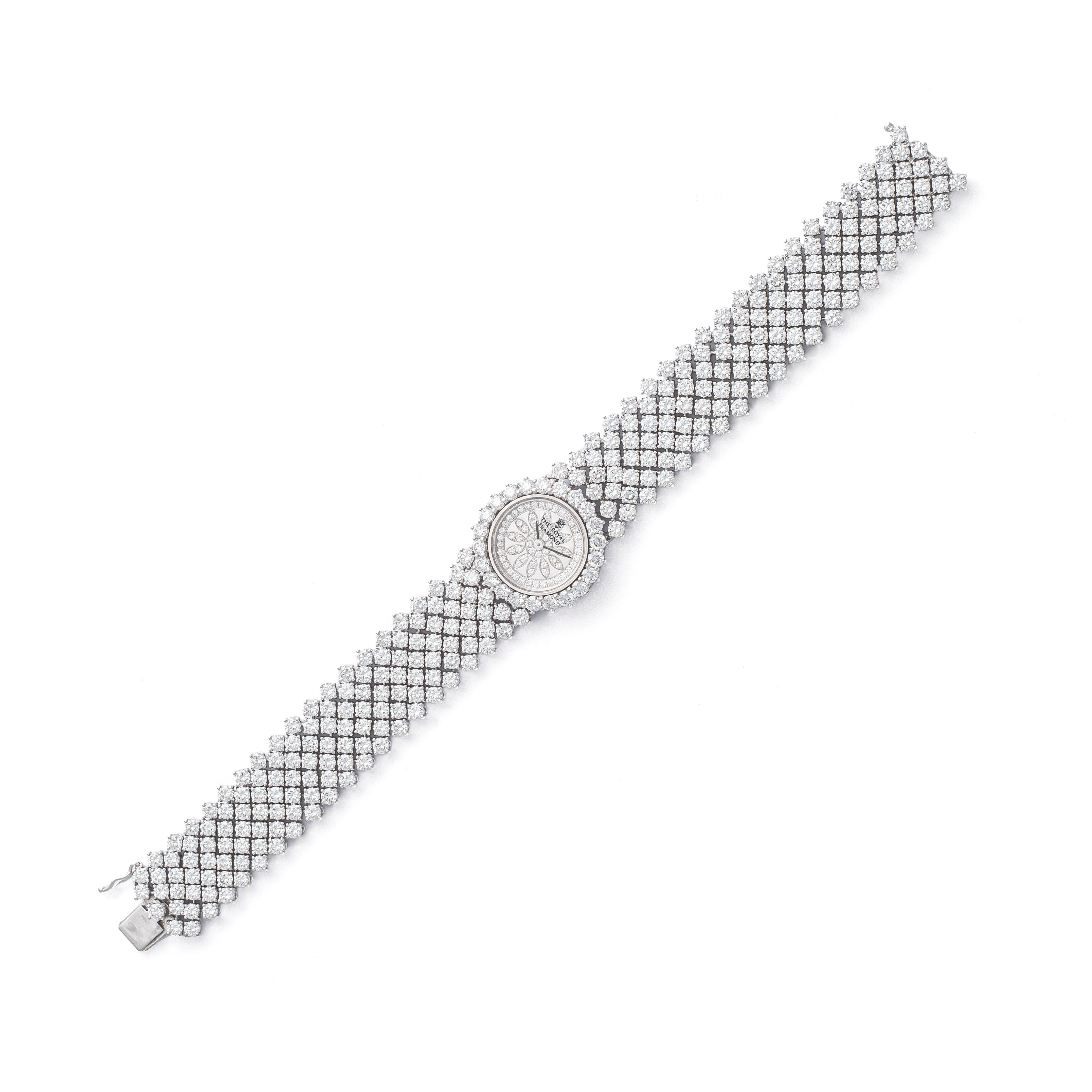 The Royal Diamond Swiss Full Diamond Wristwatch.
Made in SWITZERLAND. Swiss marks.
Numbered BA 321.
361 round cut Diamond, estimated in our opinion total about 21 carats.

Length: 17.50 centimeters.
Width: 1.50 centimeters.

Total weight: 51.70