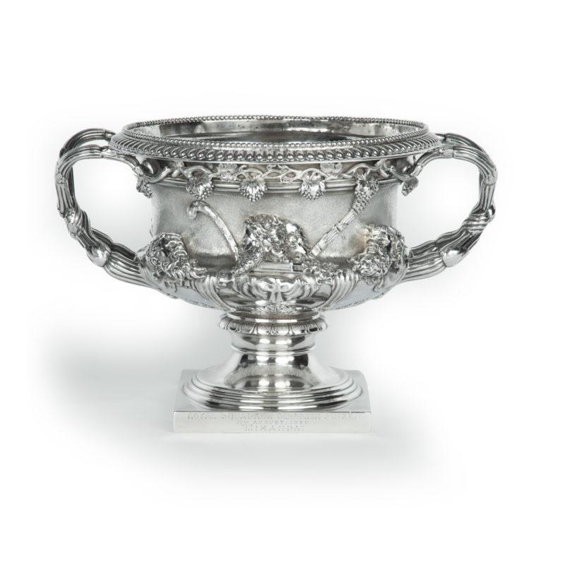 The Royal Squadron Schooner Prize won by Miranda, 1877. This impressive trophy is a small replica of the classical Roman ‘Warwick Vase’.  The body is cast and chased with fruiting vines below the rim.  The central field has a continuous band with