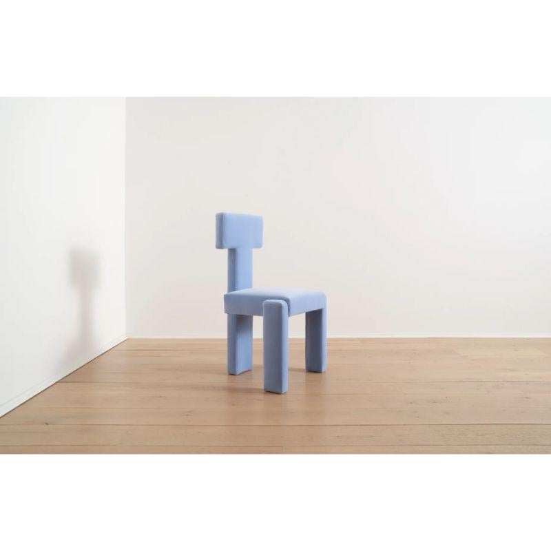 The Segment Highback Dining Chair suits many different interior arrangements: incorporate it as a sculptural velvet lounge chair in your living room or as a bold. blue addition to a dining table or desk, and immediately elevate your