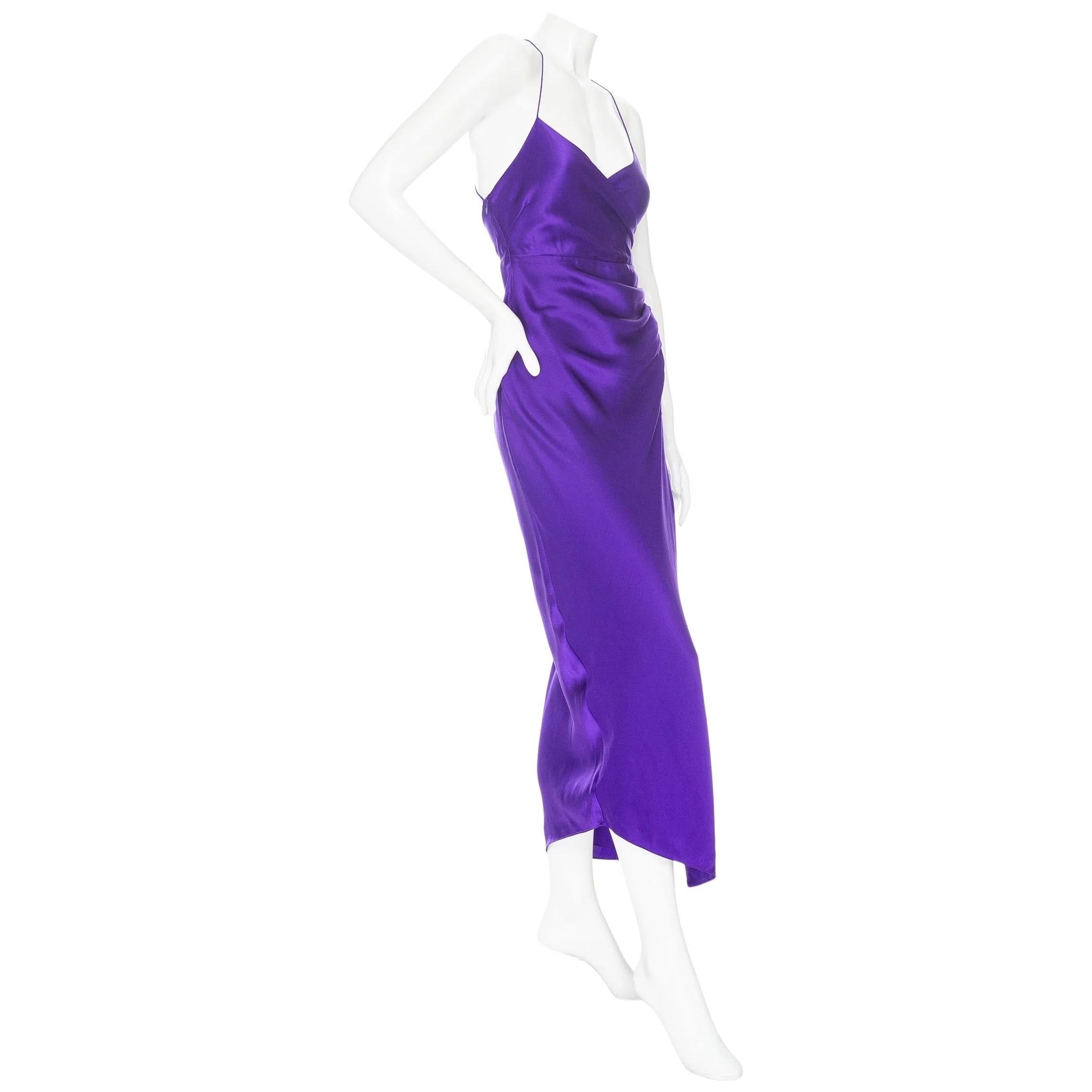 The Sei Violet Silk Draped Slit Midi Dress 

Violet Purple
Surplice v-neckline
Thin straps crisscross at back
Ruched draped detail at side
High leg slit
Asymmetrical hem
Hidden side zipper
Imported
100% silk; 100% silk lining
Excellent preowned