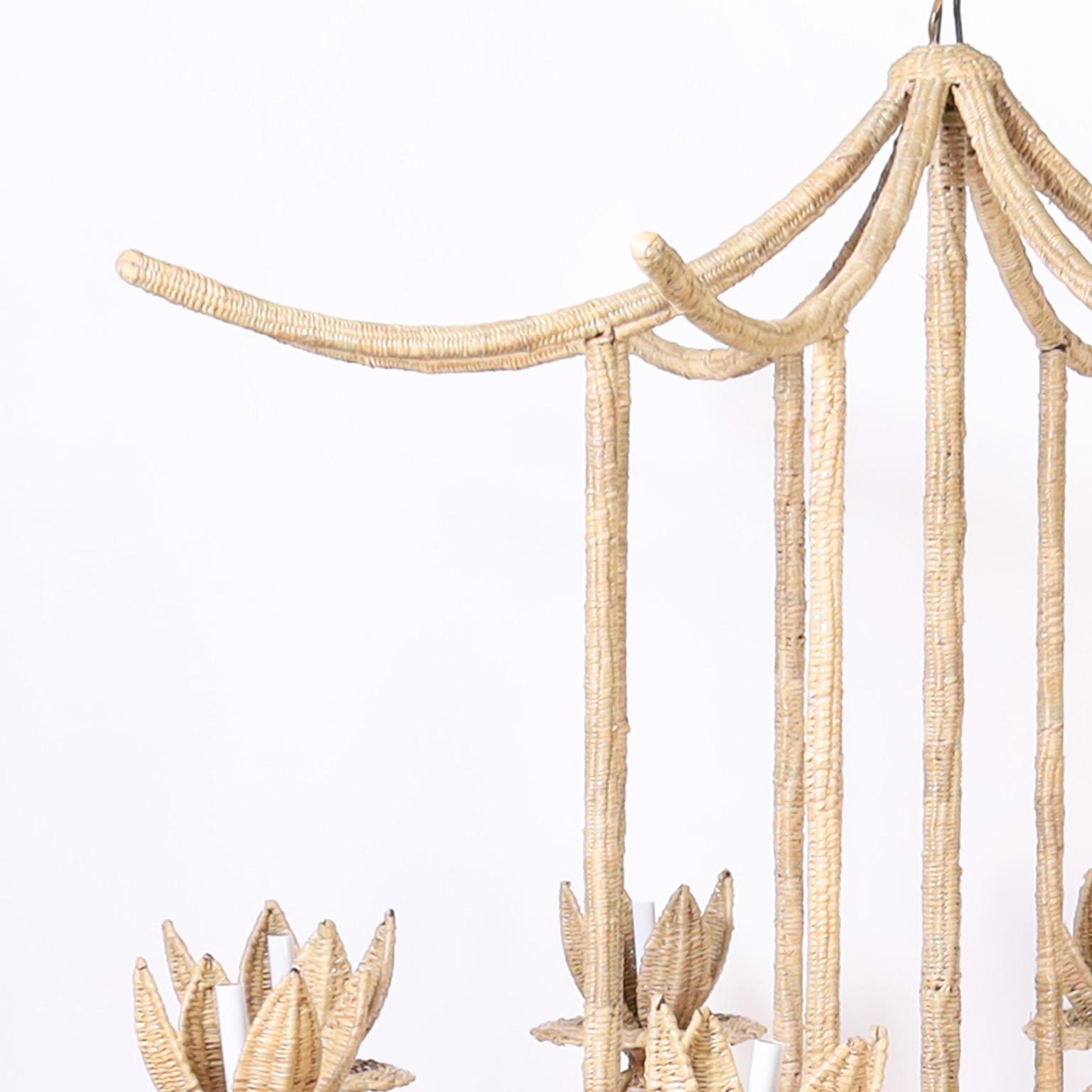 The Seychelles, a chic midcentury inspired pagoda form eight light chandelier handcrafted with a durable metal frame ambitiously wrapped in reed, from the 2023 FS Flores Collection, designed and manufactured exclusively by F.S. Henemader Antiques.