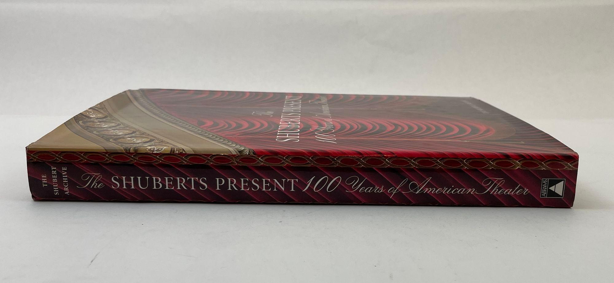 The Shuberts Present: 100 Years of American Theater Book by Maryann Chach.
Looks at theater palaces owned by the Shubert Organization in New York City and shows how their history fits into the history of American theater during the twentieth