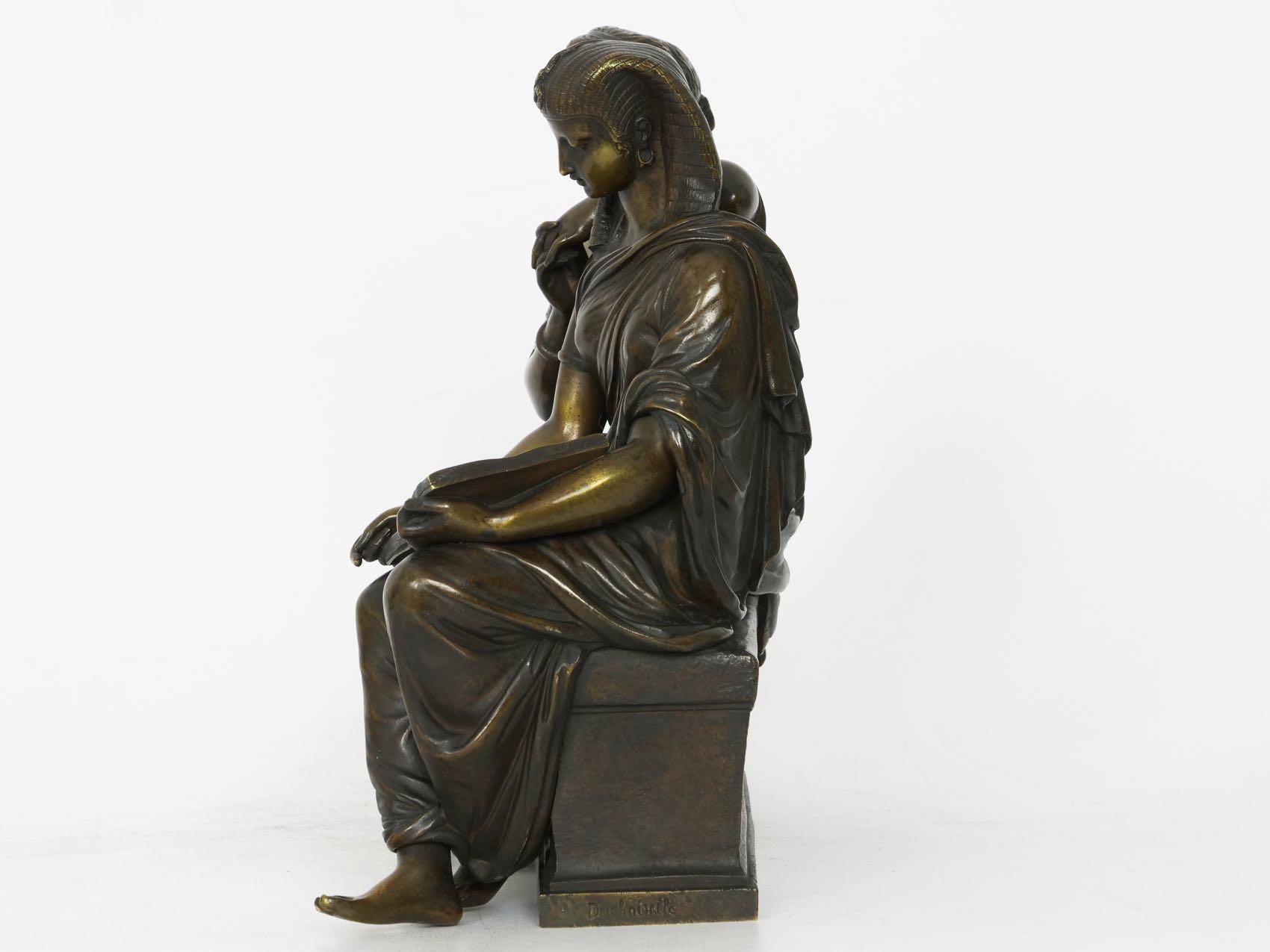 A beautifully cast model by 19th century sculptor Duchoiselle, it is a moving subject that depicts a Babylonian Sibyl passing ancient knowledge on to her Greco-Roman sister in the future. It is an admirable and inspired the handling of a subject
