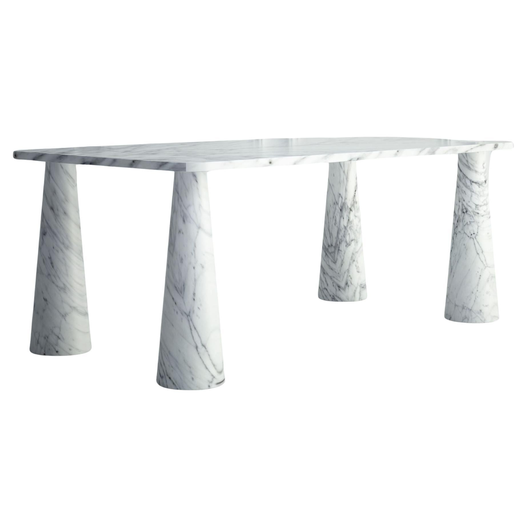 The Simone : une table de salle à manger moderne en pierre avec un plateau rectangulaire et des pieds ronds