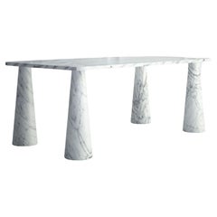 The Simone: A Modern Stone Dining Table with a Rectangular Top and Round Legs