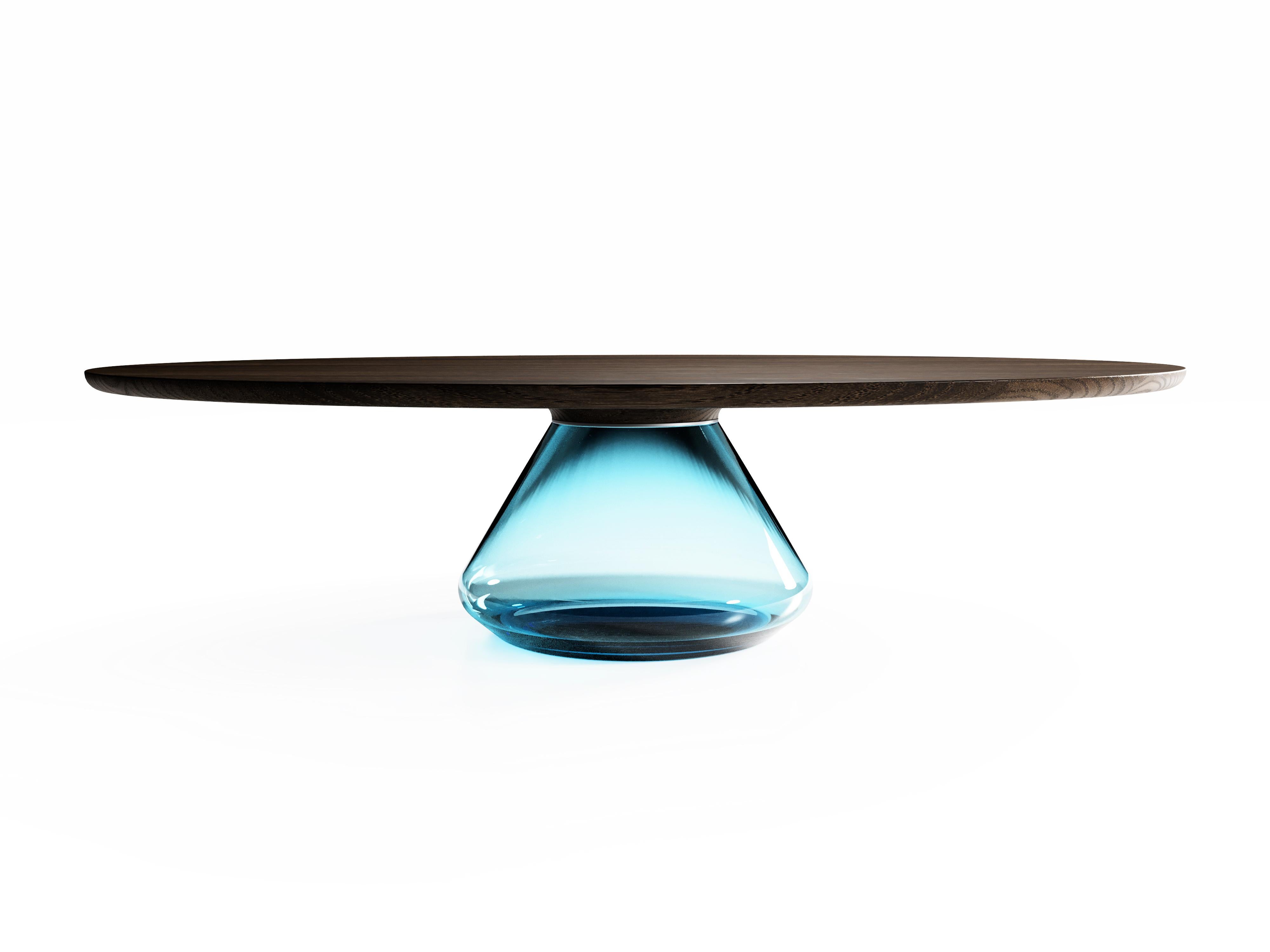 The sky Eclipse I, limited edition coffee table by Grzegorz Majka
Limited Edition of 8
Dimensions: 54 x 48 x 14 in
Materials: Glass, oak

The total eclipse of every interior? With this amazing table everything is possible as with its Minimalist