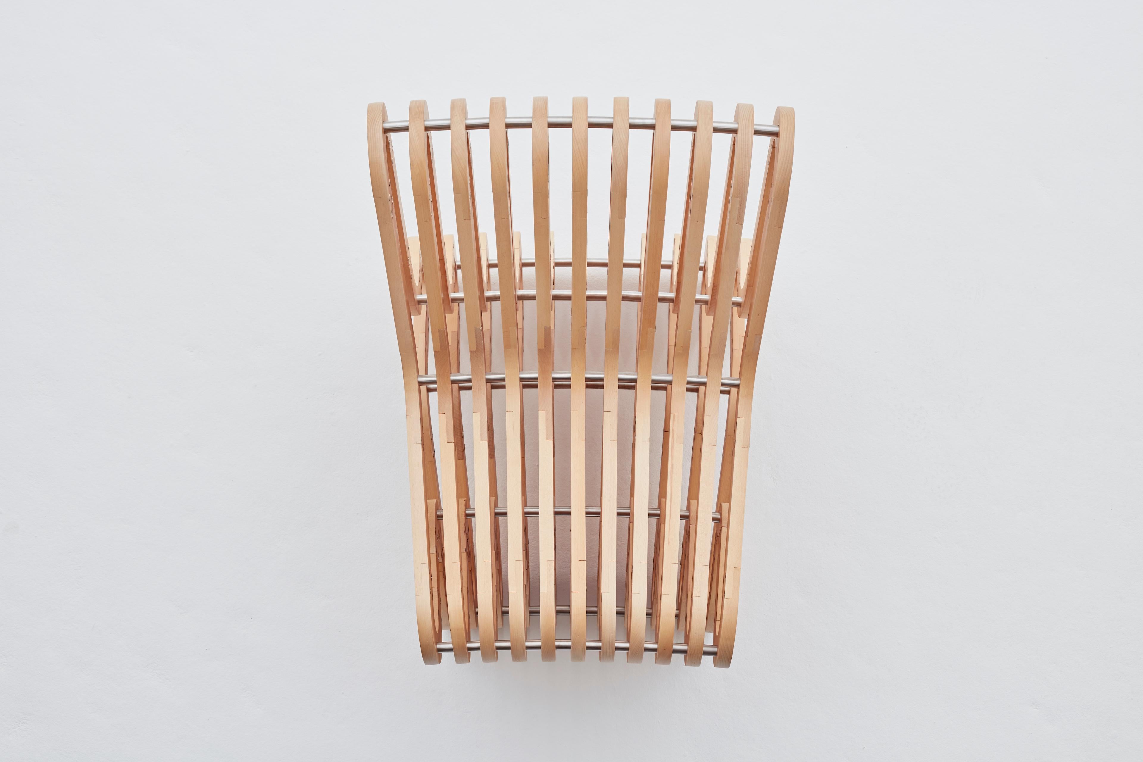 George Gibbens' Slank Occasional Chair draws inspiration from the concept of an open-ended labyrinth and applies it to an episodical context. Each chair takes three months to complete and is made from 176 individually CNC'd pieces of European beech.