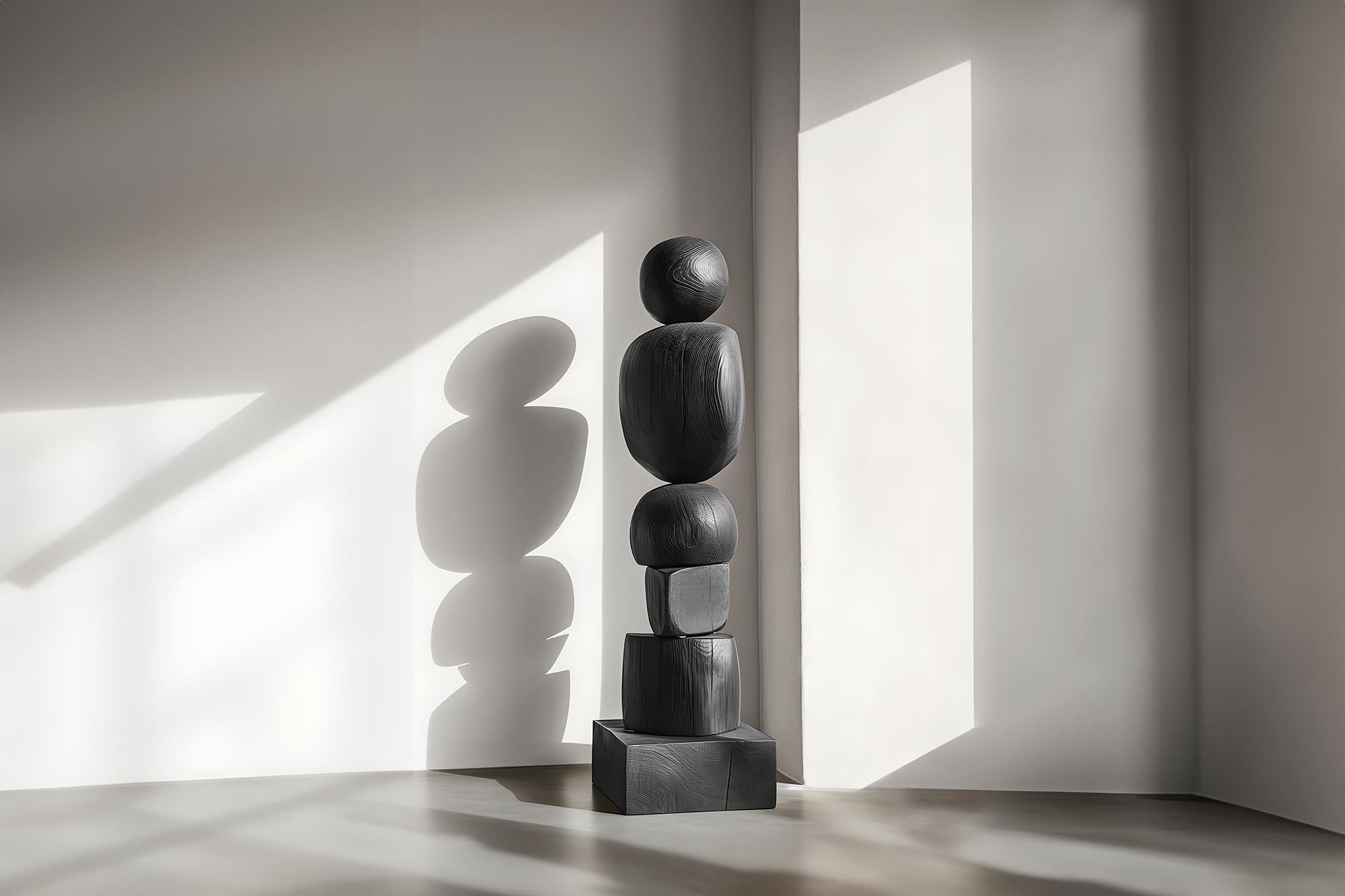 The Sleek Totem of Dark Elegance in Black Solid Wood, Still Stand No90
——

Joel Escalona's wooden standing sculptures are objects of raw beauty and serene grace. Each one is a testament to the power of the material, with smooth curves that flow into