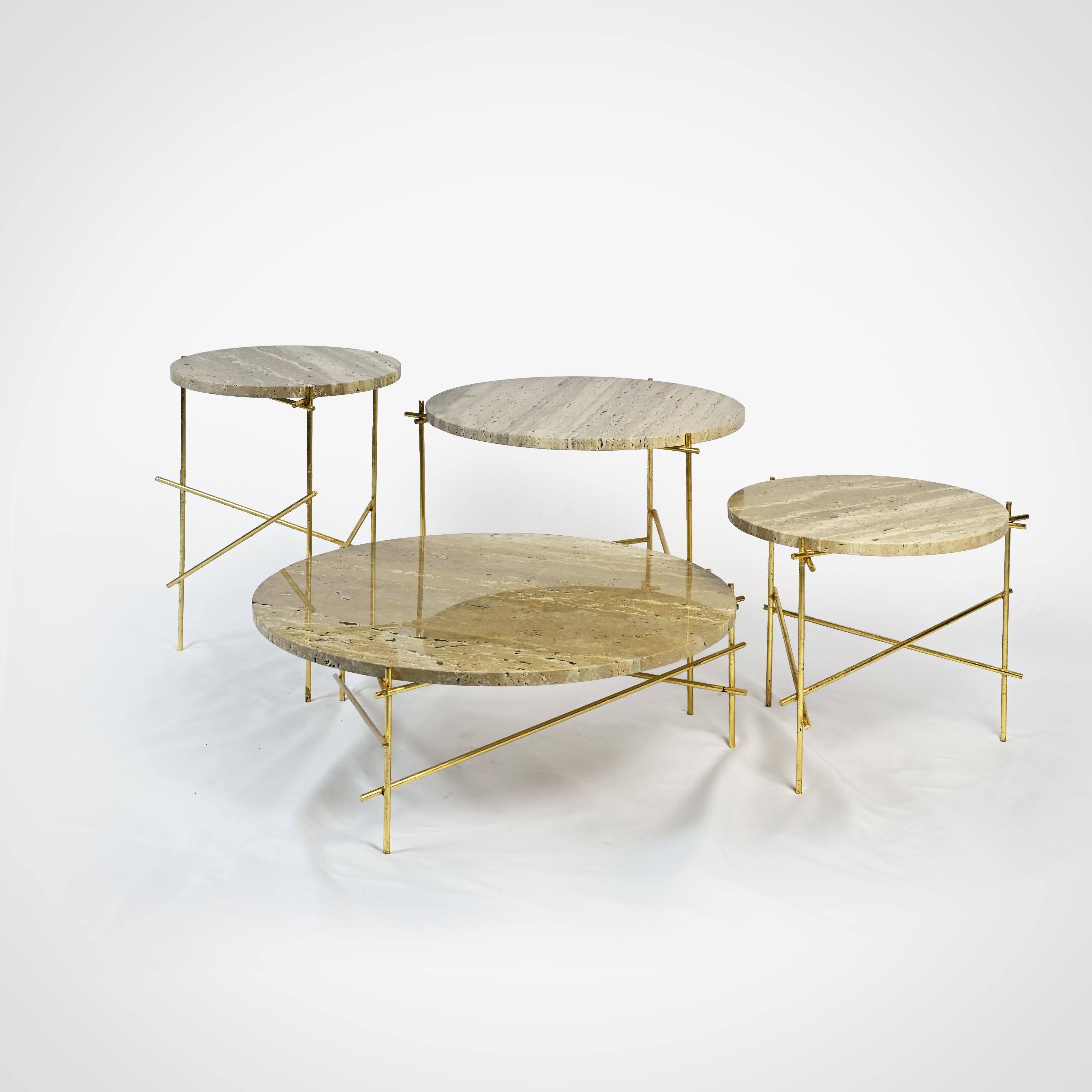 The Stilts coffee table collection is created through the combination of Carrara Marble tops and steel legs, which are finished with a golden leaf application.
The golden leaf application is purposely refined with a scratched effect, and works in