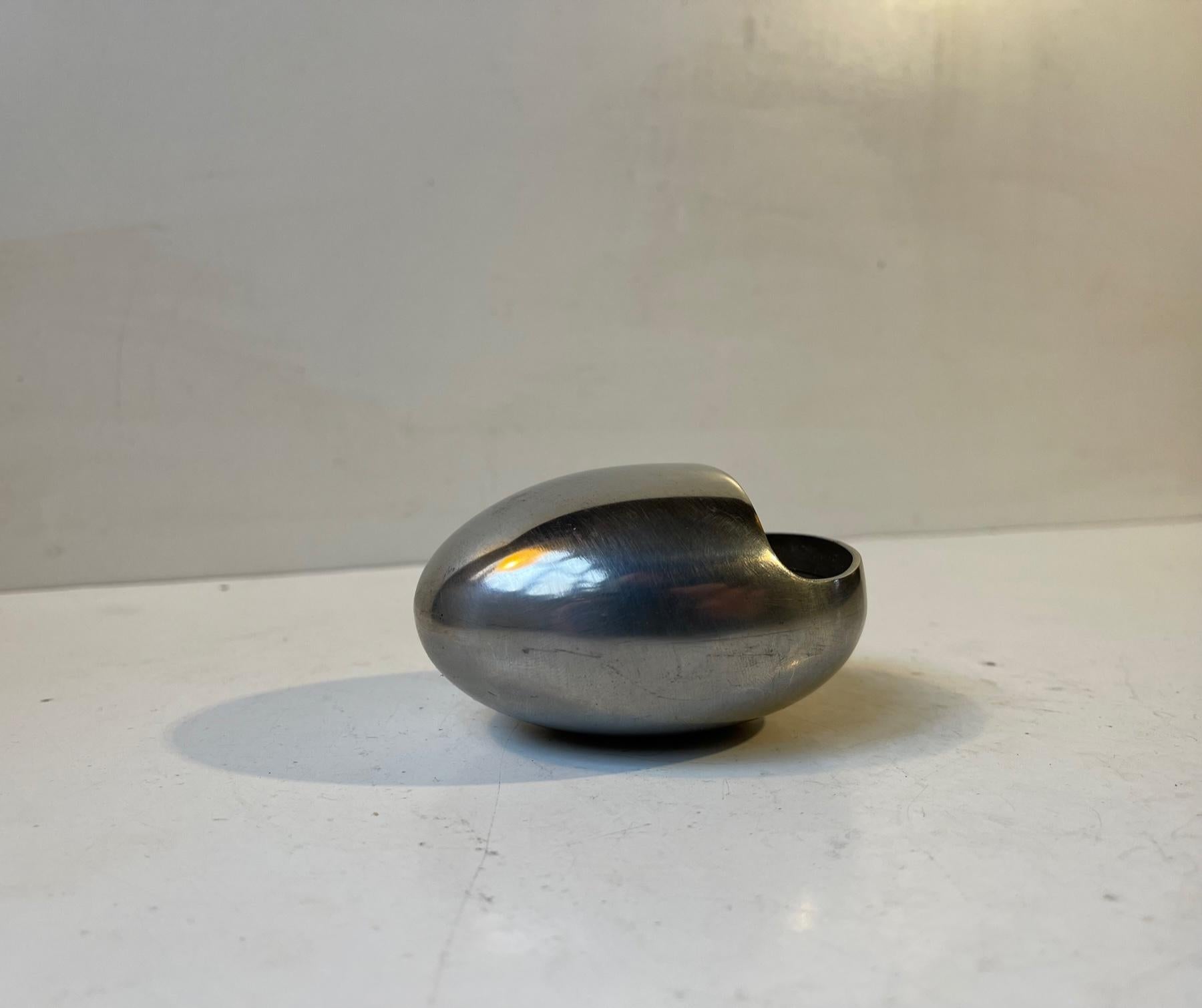 Egg shaped stainless steel ashtray. Very rare in this metal composition - brushed stainless. It is called the smile and was designed by Hans Bunde and manufactured by Carl Cohr in Fredericia Denmark during the 1950s. Stamped Cohr, Denmark - to the