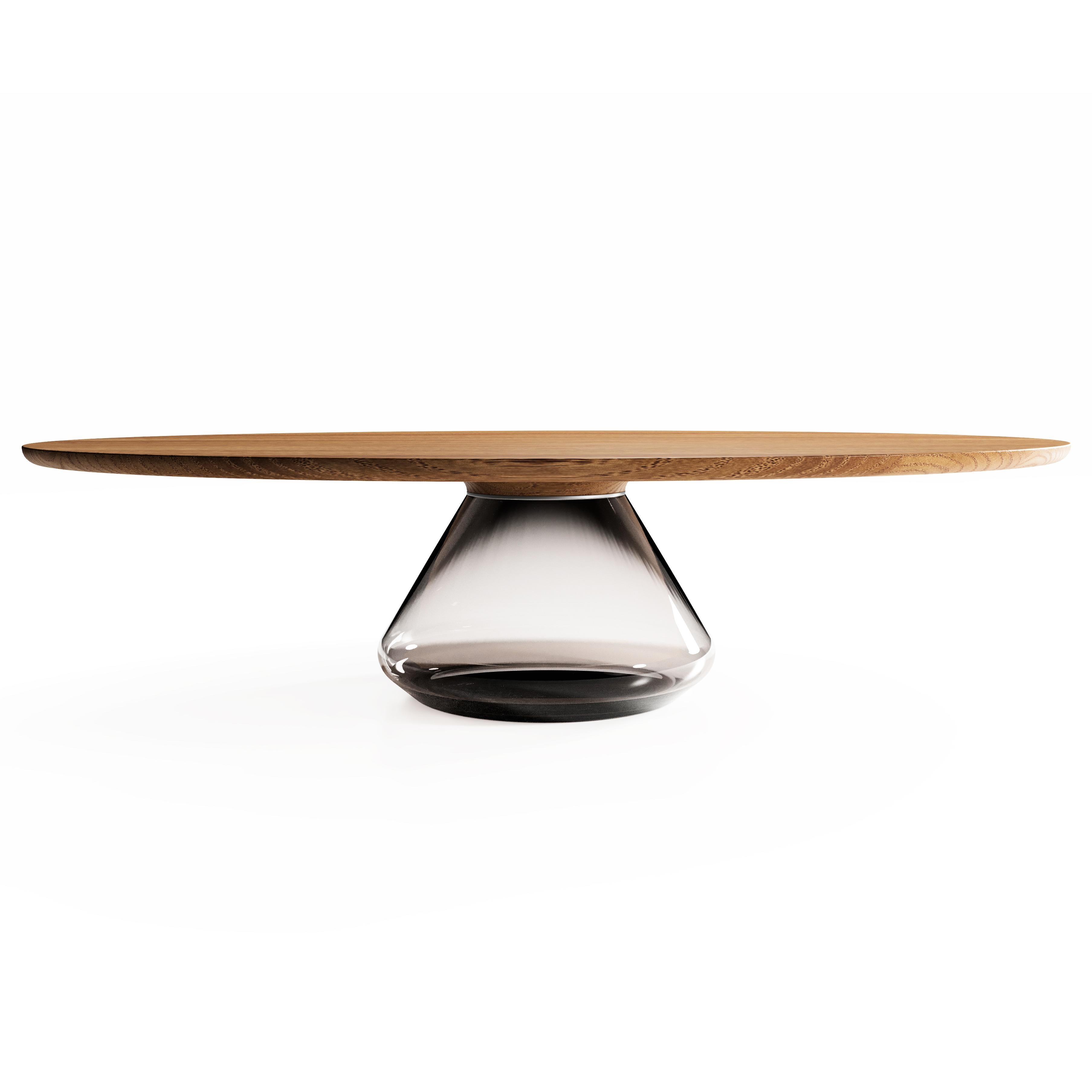 The Smoky Eclipse I, limited edition coffee table by Grzegorz Majka
Limited Edition of 8
Dimensions: 54 x 48 x 14 in
Materials: Glass, oak

The total eclipse of every interior? With this amazing table everything is possible as with its