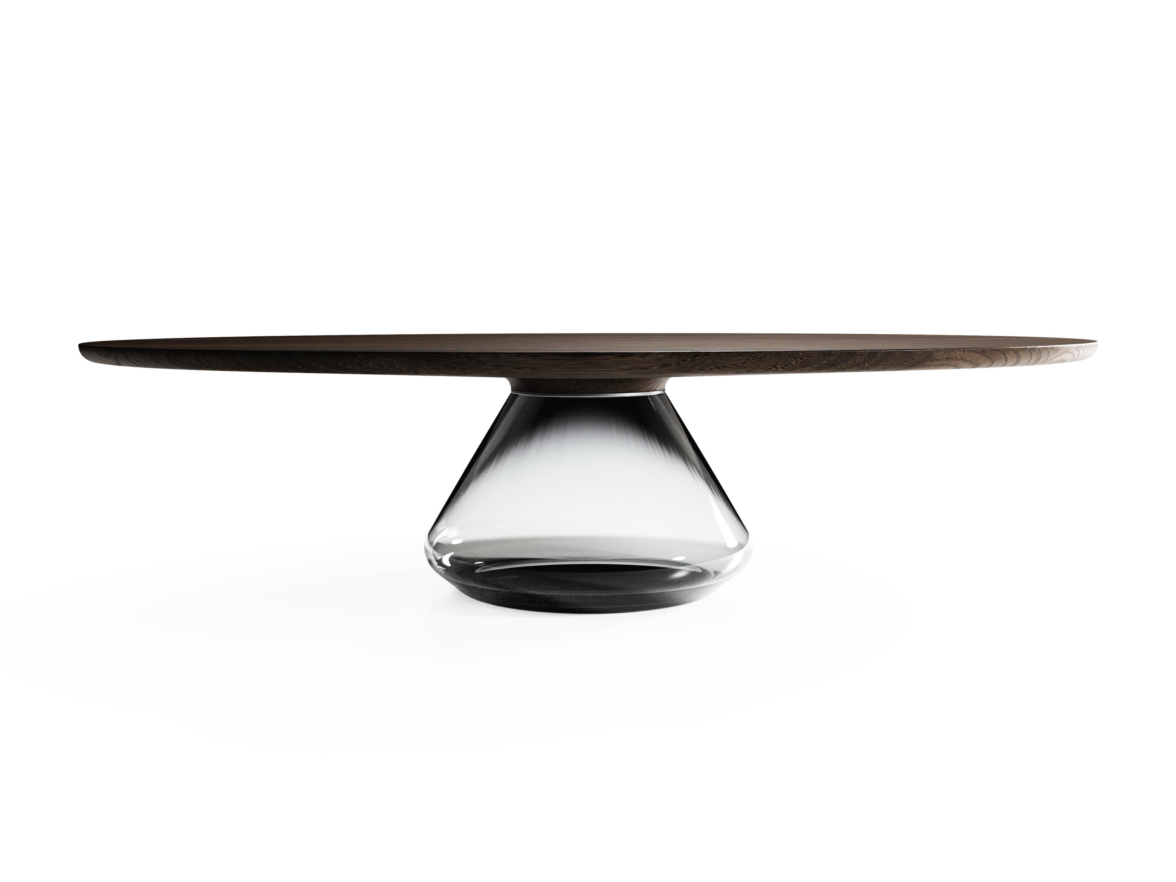 The Smoky Eclipse I, limited edition coffee table by Grzegorz Majka
Limited edition of 8
Dimensions: 54 x 48 x 14 in
Materials: glass, oak

The total eclipse of every interior? With this amazing table everything is possible as with its