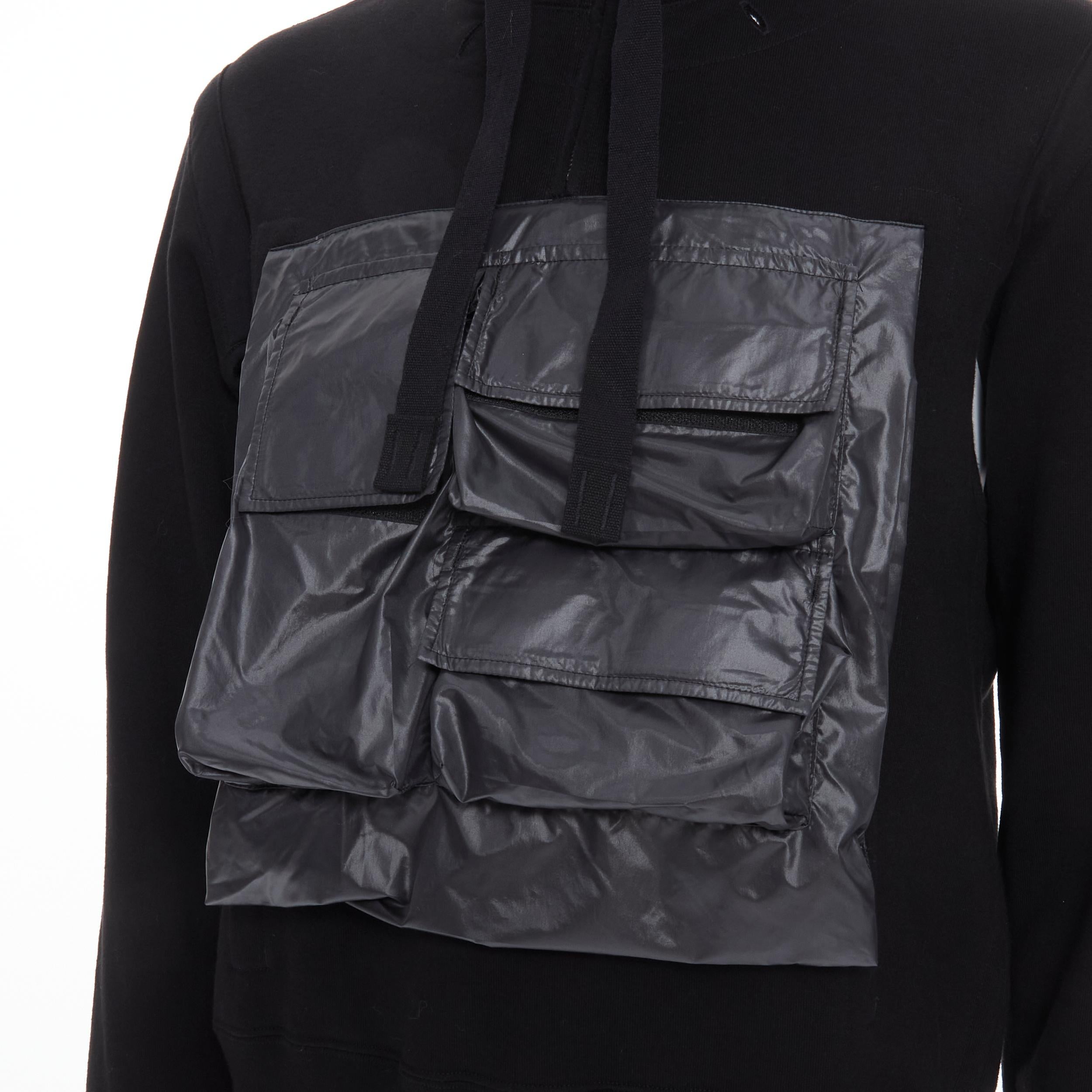 THE SOLOIST Takahiro Miyashita black nylon multi pocket cropped hoodie IT48 M 
Reference: JOMK/A00012 
Brand: The Soloist 
Designer: Takahiro Miyashita 
Material: Cotton 
Color: Black 
Pattern: Solid 
Extra Detail: Nylon pockets at front. Silver