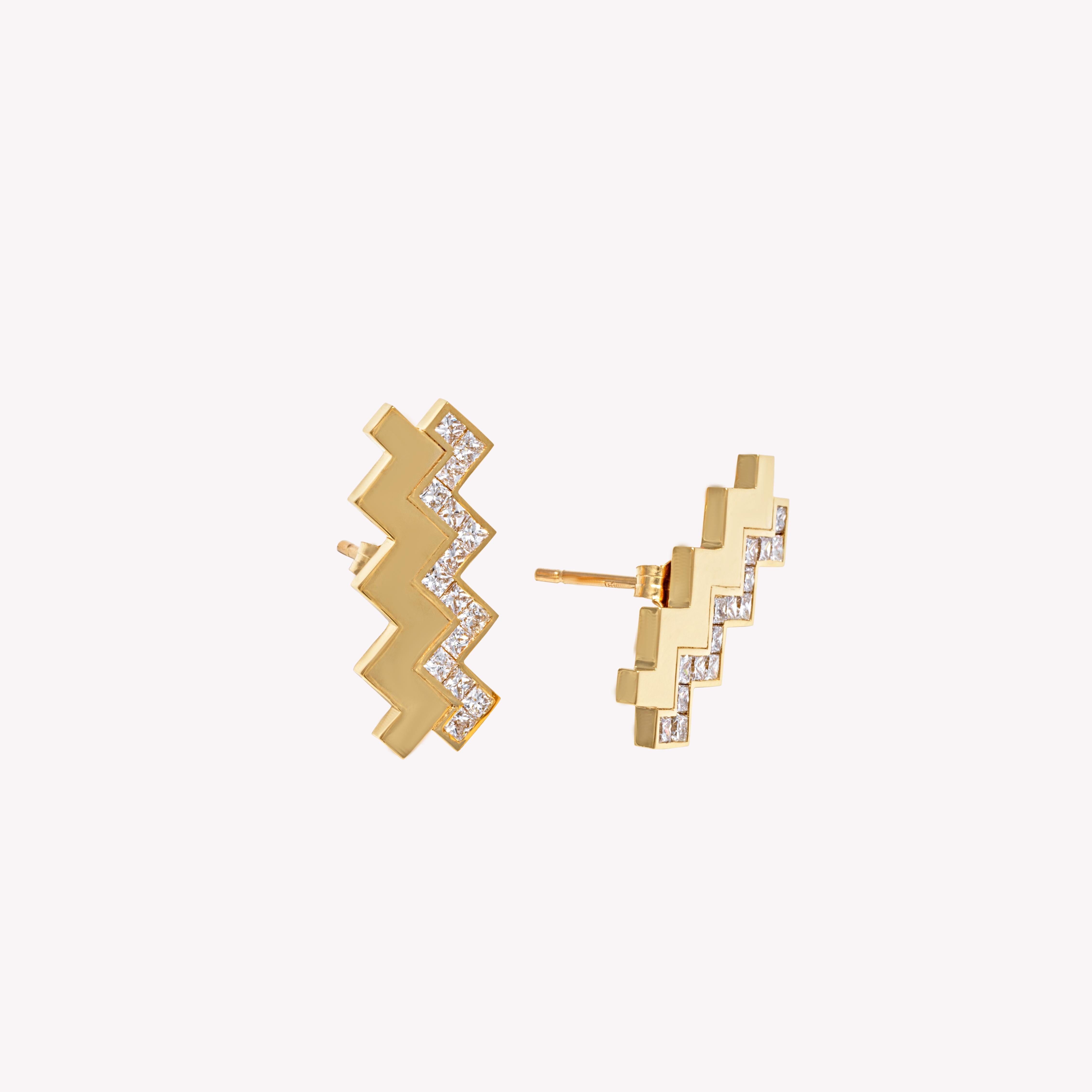 The Sonia Studs: Bold yet refined, the Sonia Studs feature a striking double-zigzag silhouette inspired by Art Deco geometry. Each stud pairs a sleek, polished 18k yellow gold zigzag with a second line set with sparkling princess-cut diamonds,